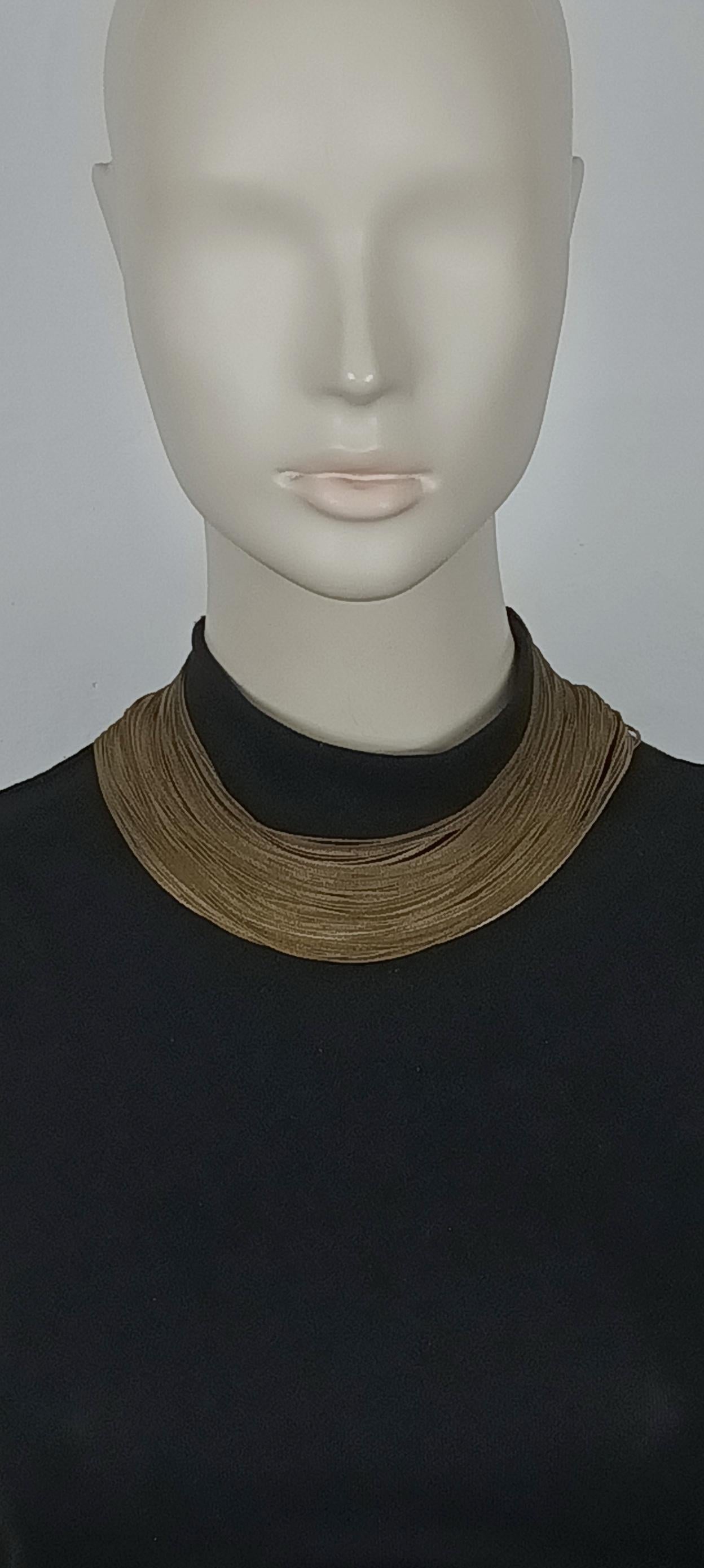 JEAN PAUL GAULTIER vintage antiqued bronze tone multi chain choker necklace.

Adjustable hook clasp closure.

Marked GAULTIER.

Indicative measurements : adjustable length form approx. 35 cm (13.78 inches) to approx. 39.5 cm (15.55