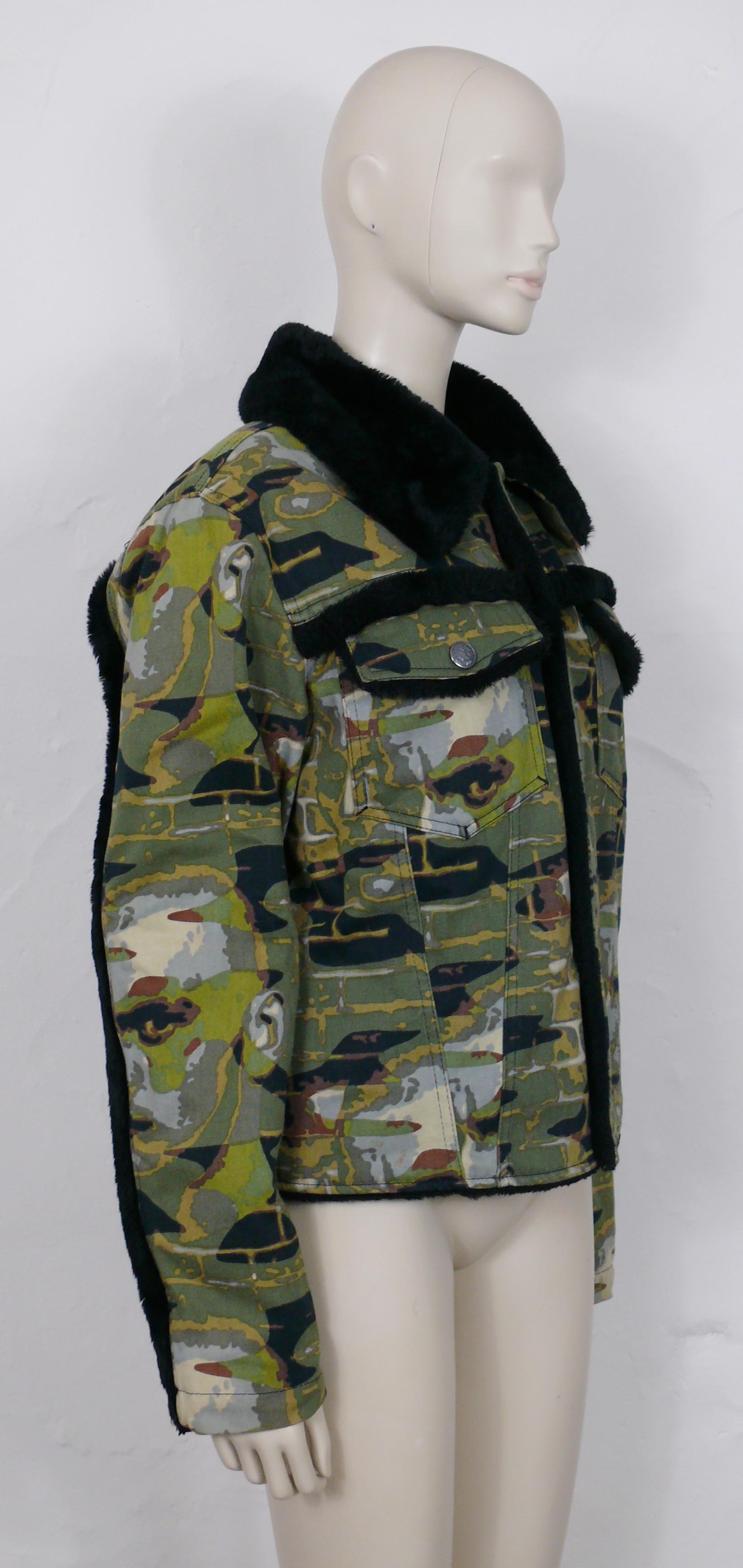 JEAN PAUL GAULTIER vintage jacket featuring a green/brown/black camouflage print with faces and walls.

This jacket features :
- Green/brown and black camouflage design print featuring faces and walls.
- Classic collar with black faux fur.
- Faux