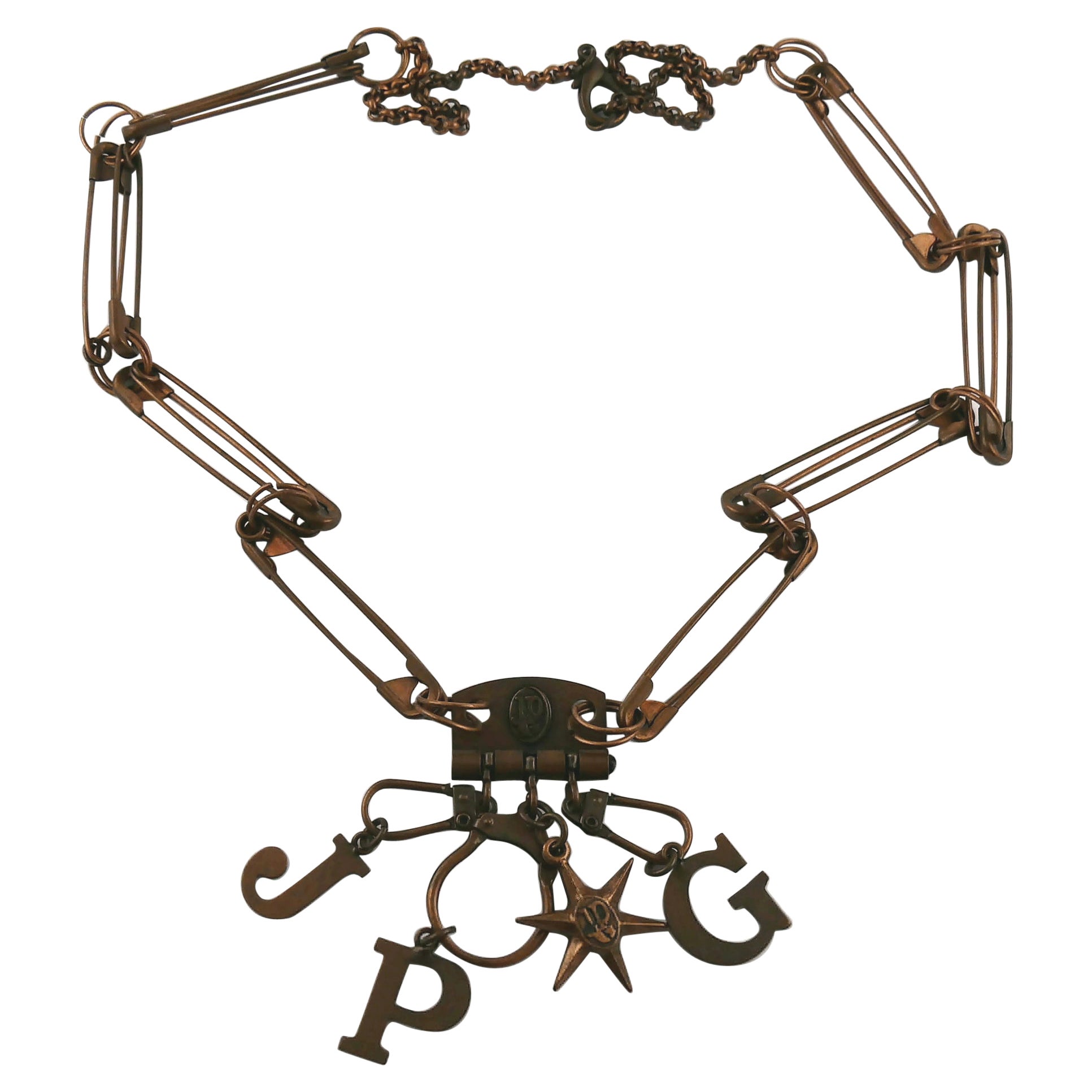 Collar con pasador de seguridad y charms Jean Paul Gaultier Vintage en tono cobre en venta