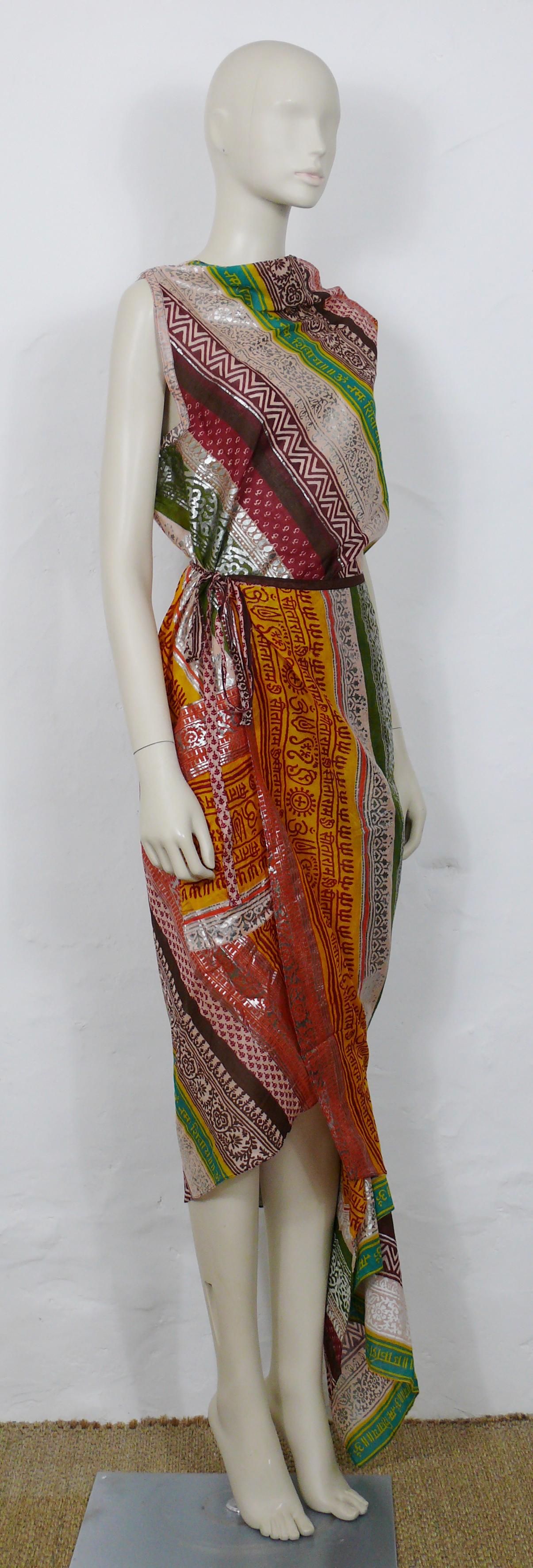 JEAN PAUL GAULTIER vintage cotton sari featuring a gorgeous multicolor print with silver toned frieze patterns.

This sari wraps around the body and attaches with straps.
There are two asymetric locations to pass the arms (see the picture 6) and a