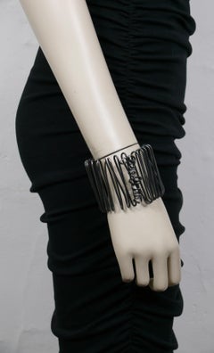 JEAN PAUL GAULTIER (Attribuito a) Bracciale d'epoca a spirale in corsivo