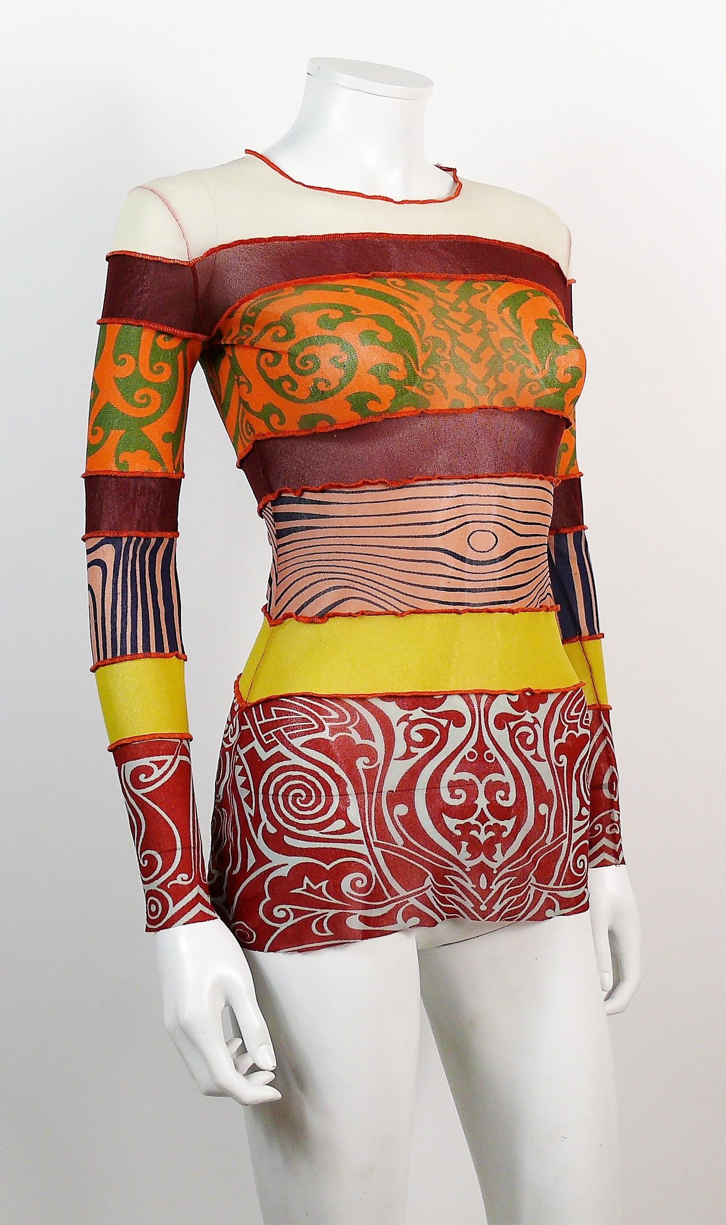 JEAN PAUL GAULTIER Maille vintage iconic and rare Cyberbaba tattoo and body map optical illusion sheer mesh top.

Model variation worn by supermodel HELENA CHRISTENSEN at the JEAN PAUL GAULTIER Spring/Summer 1996 runway show.

Label reads JEAN PAUL