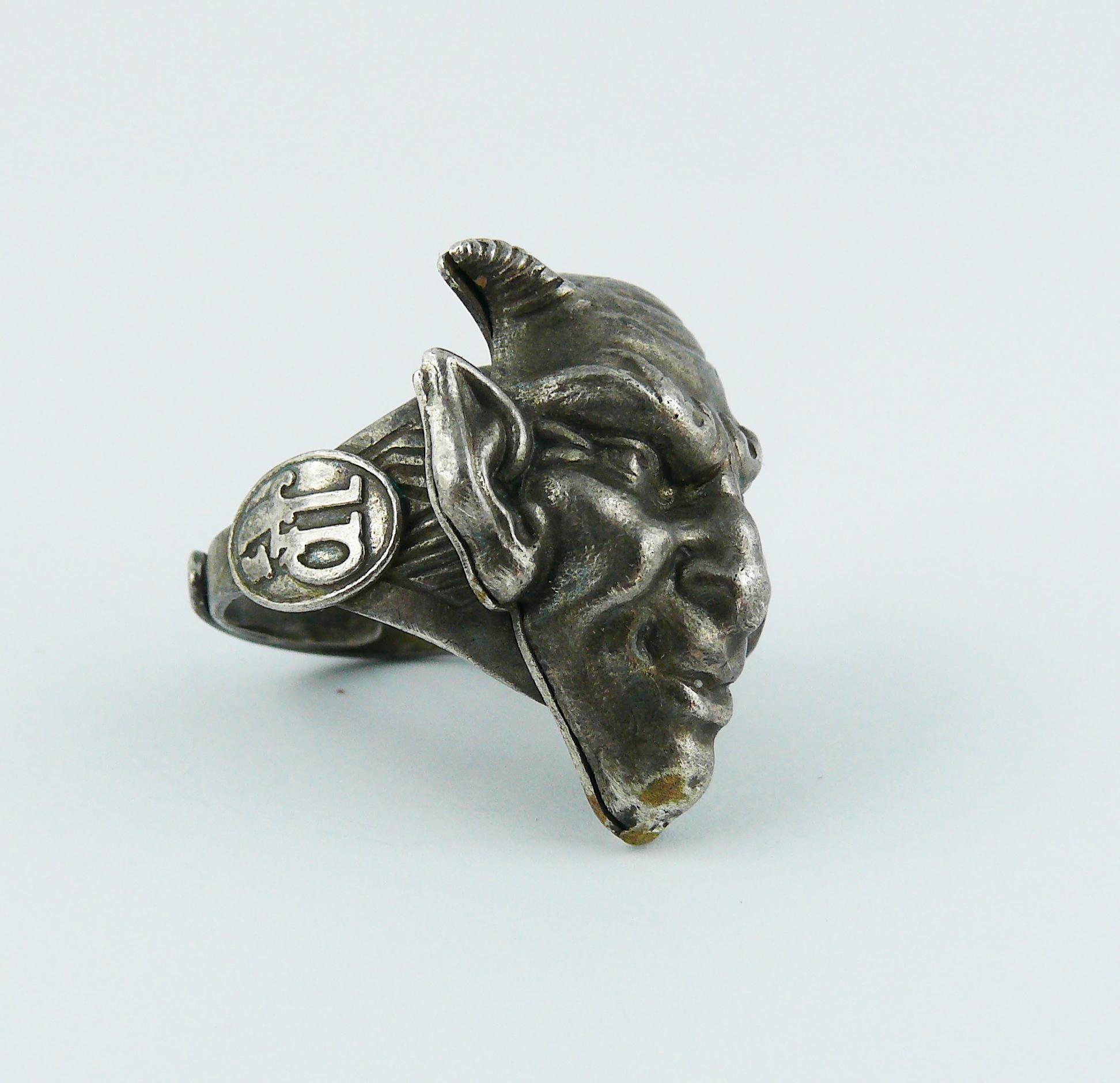 JEAN PAUL GAULTIER vintage antiqued silver toned ring featuring a demon head.

From the Fall/Winter 1994 Collection MONGOLE.

Marked JPG.

Adjustable size.

Indicative measurements : demon head approx. 2.5 cm x 2 cm (0.98 inch x 0.79 inch).

JEWELRY