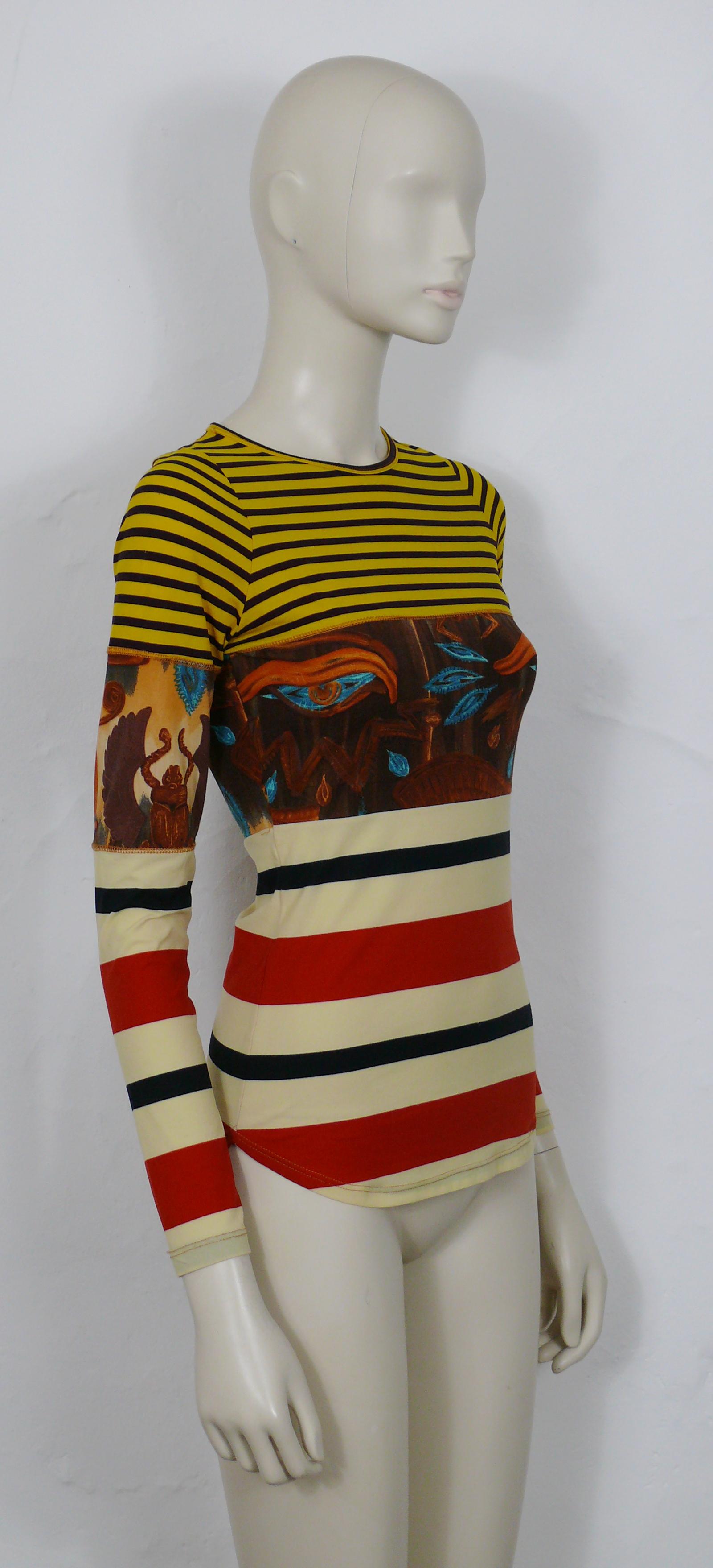 JEAN PAUL GAULTIER vintage stretch top featuring multicolored stripes and Egyptian symbols : eyes, scarabs, cartouches and hieroglyphs.

Label reads GAULTIER JEAN'S.

Missing composition tag.

Missing size tag.
Please refer to