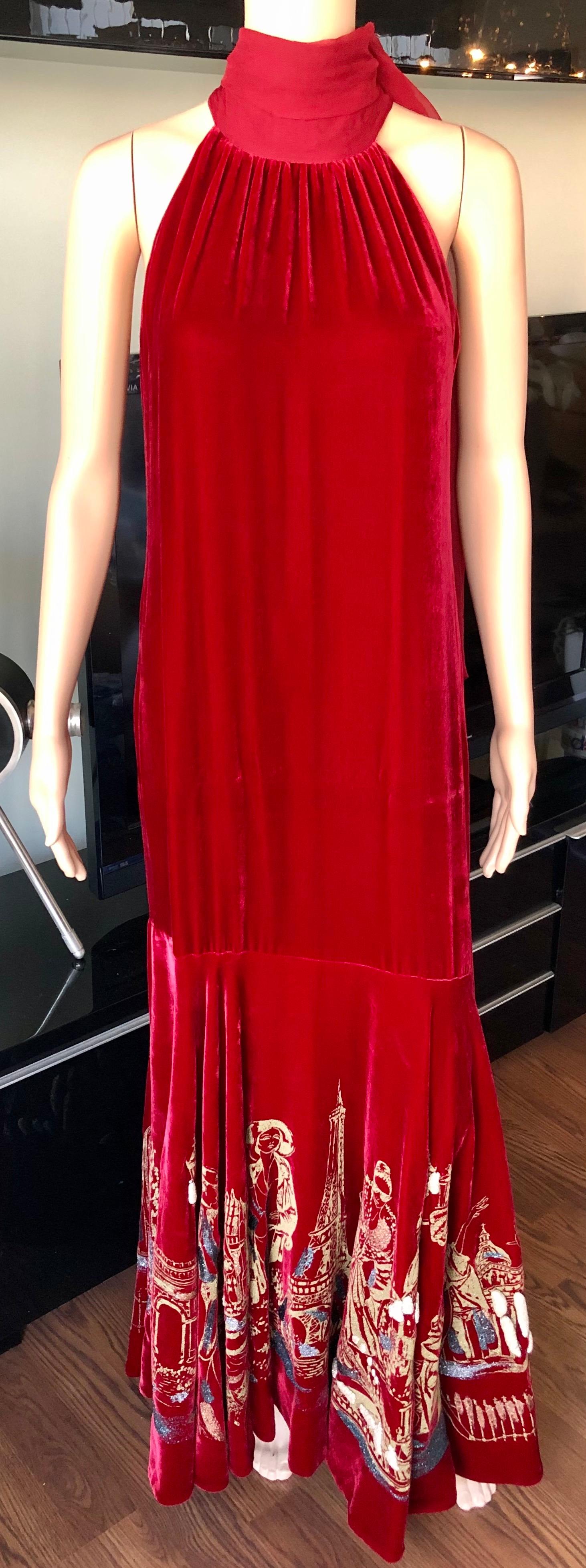 Jean Paul Gaultier Vintage Embellished Landmarks Velvet Maxi Evening Dress Gown IT 44

Jean Paul Gaultier vintage red velvet maxi dress featuring trumpet skirt painted with glitter landmarks, sash tie scarf at neck, fully lined, zipper at