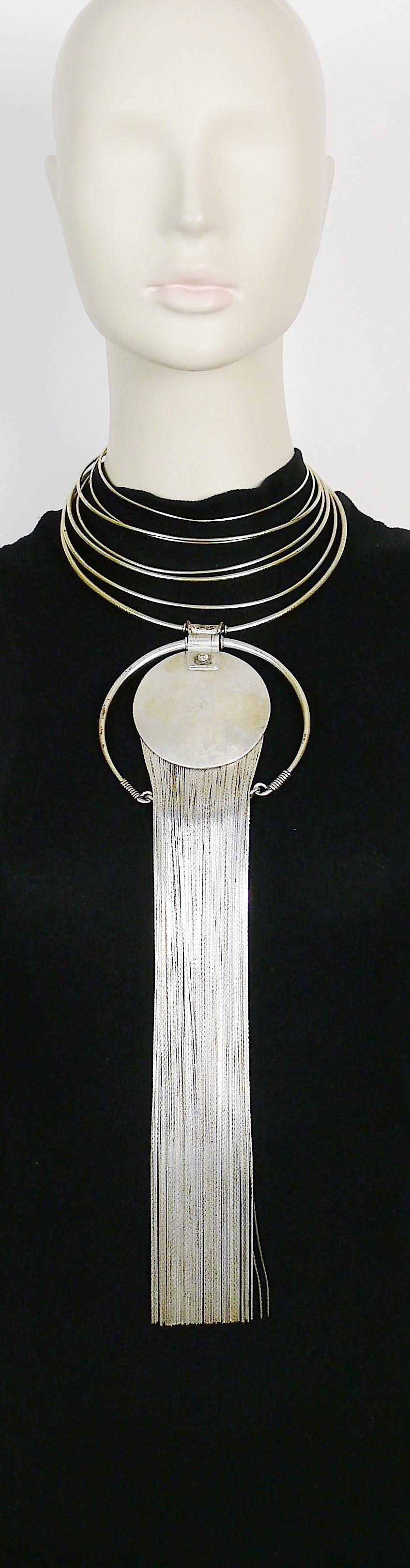 JEAN PAUL GAULTIER vintage silver toned wired torque necklace featuring an extra long fringed hammered disc pendant.

Marked GAULTIER.

Indicative measurements : torque will adapt to most of the neck sizes / pendant length (incl. fringes) approx. 33