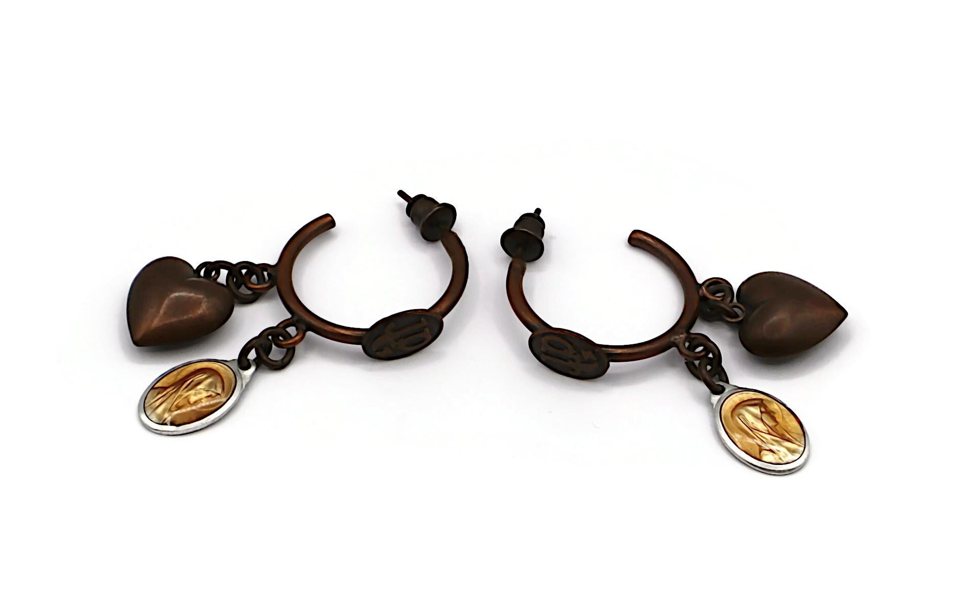JEAN PAUL GAULTIER  vintage antiqued copper tone hoop earrings (for pierced ears) featuring heart and Virgin Mary scapular medal charms.

Marked JPG.

Indicative measurements : max. height approx. 4.5 cm (1.77 inches) / max. width approx. 2.2 cm