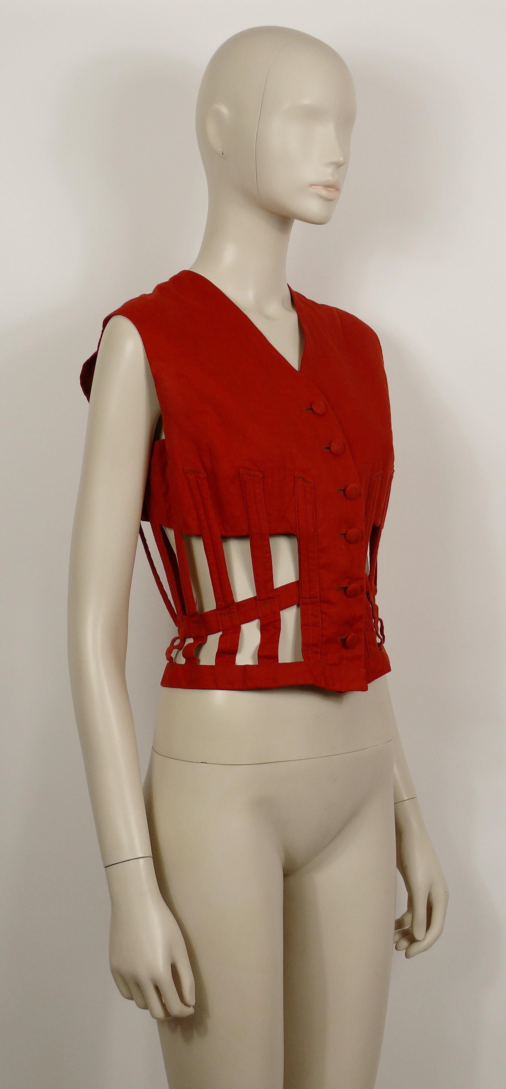 JEAN PAUL GAULTIER vintage iconic brick red vest.

This jacket features :
- Cage openwork with corset bones design.
- Laced back.
- Button down closure.

Label reads JEAN PAUL GAULTIER FEMME.

Size label reads : 42.
Please refer to