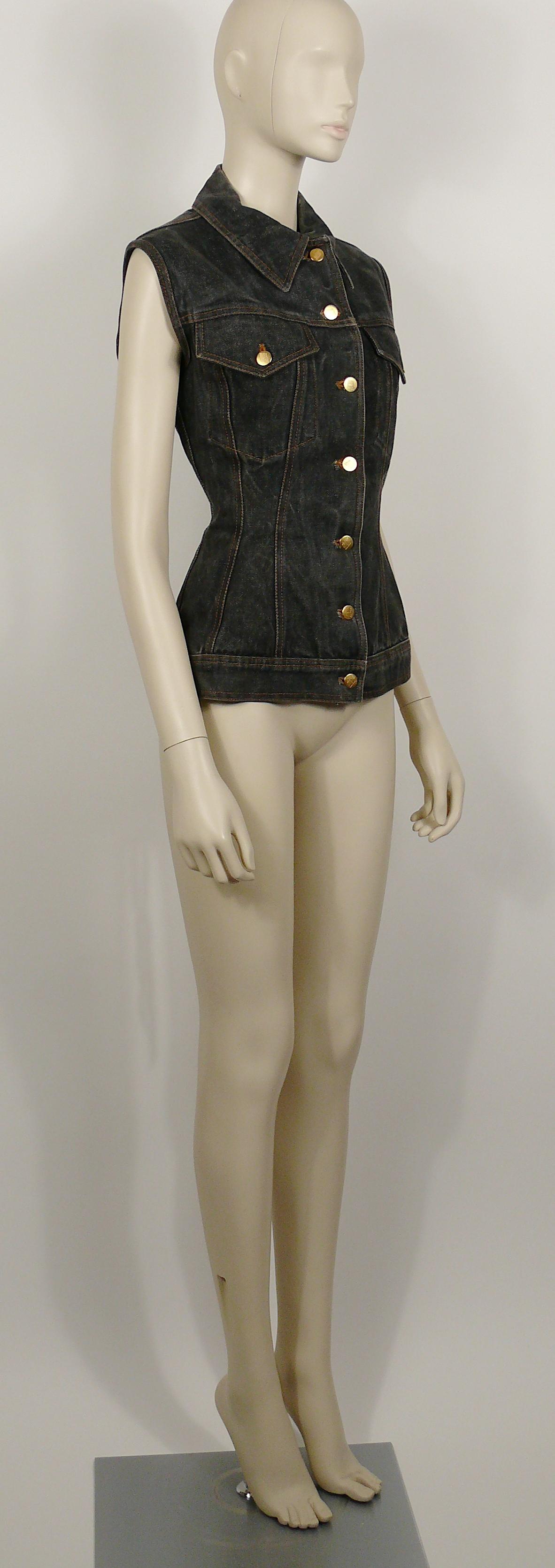 JEAN PAUL GAULTIER vintage distressed black denim corset style sleeveless jacket.

This jacket features :
- Beautiful iconic back lace up detail.
- Classic collar.
- Front button fastening.
- Pocket detail at the chest.
- Gold toned signature JUNIOR