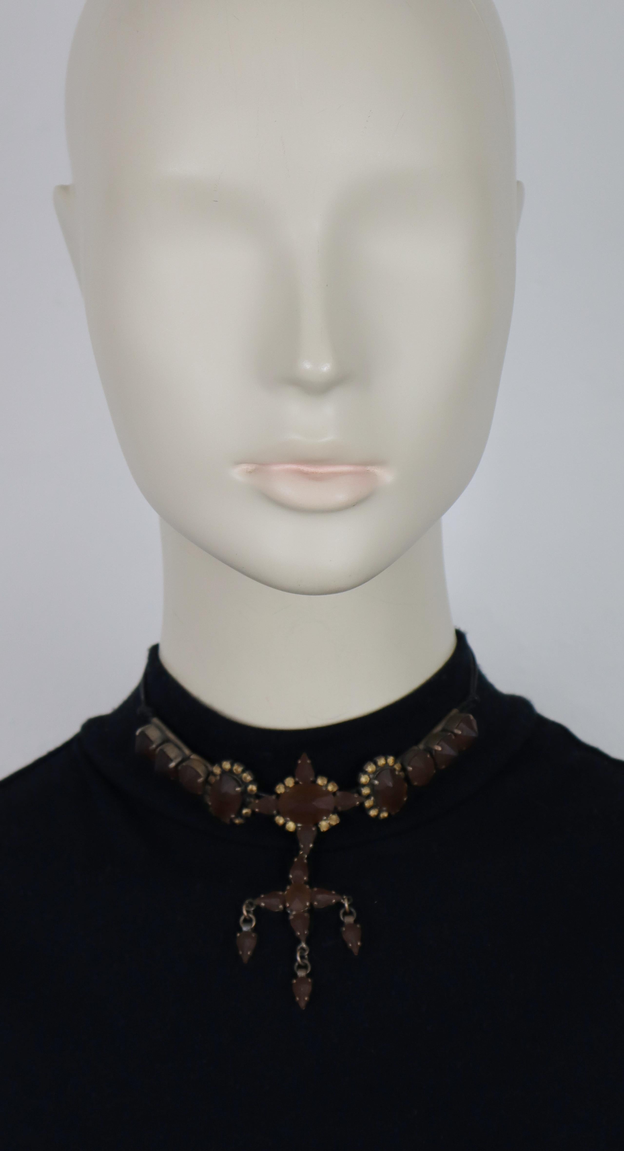 JEAN PAUL GAULTIER vintage cross pendant necklace embellished with frosted brown crystals in an antiqued/oxidized patina metal hardware.

Ties around the neck with black leather shoelaces.

Marked GAULTIER.

Indicative measurements : total length