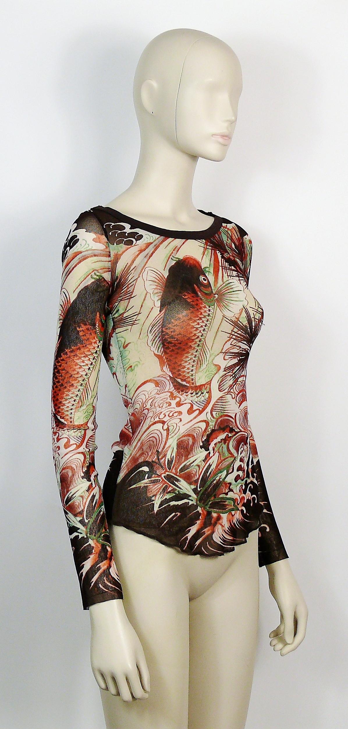 JEAN PAUL GAULTIER vintage koi tattoo mesh top. 

Label reads JEAN PAUL GAULTIER Soleil.
Made in Italy.

Size label reads : M.
Please refer to measurements.

Composition tag reads : 100% Nylon.

Indicative measurements taken laid flat and