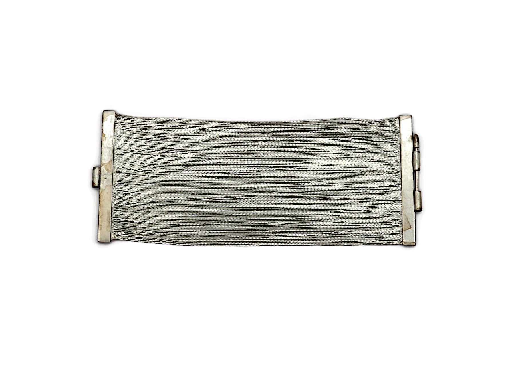 JEAN PAUL GAULTIER vintage liquid silver tone cuff bracelet.

Marked GAULTIER.

Indicative measurements : length approx. 19.50 cm (7.68 inches) / width approx. 8 cm (3.15 inches).

Material : Silver tone metal hardware.

Comes with a JEAN PAUL