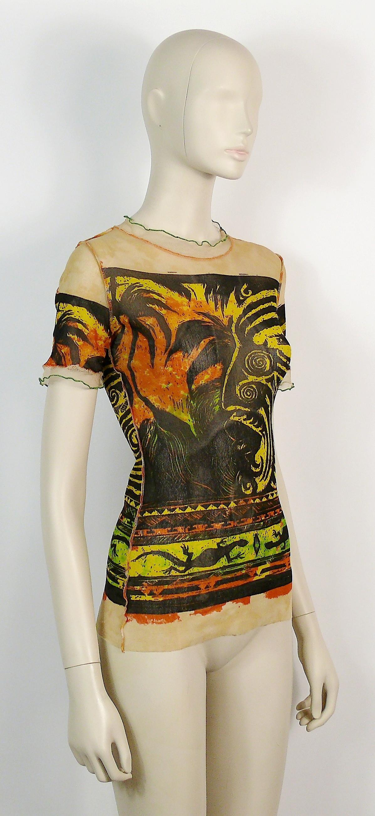 JEAN PAUL GAULTIER vintage short sleeve sheer mesh top featuring a Maori print.

Label reads JEAN PAUL GAULTIER MAILLE CLASSIQUE Paris.
Made in Italy.

Size label reads : M.
Please check measurements.

Missing composition tag.

Indicative