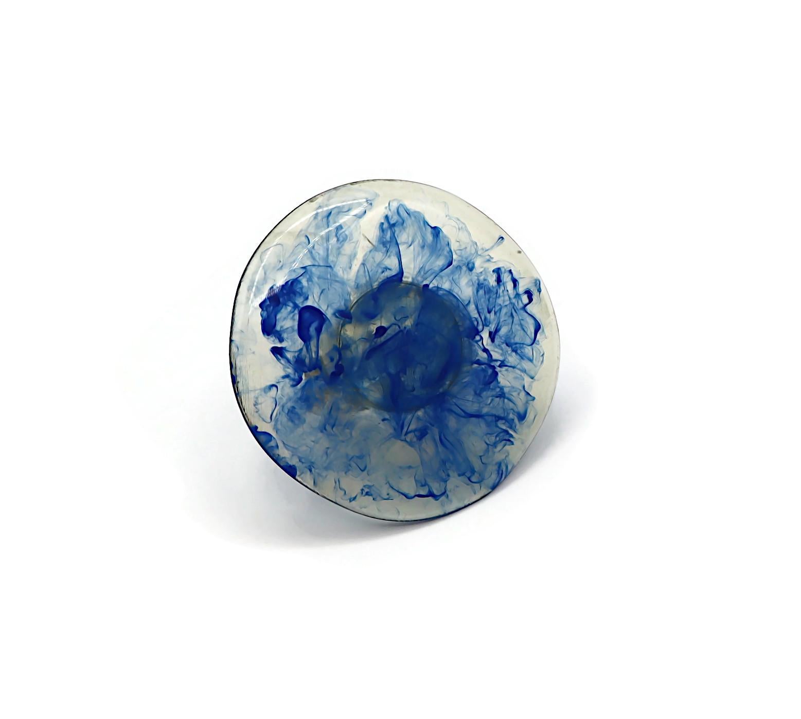 JEAN PAUL GAULTIER vintage ring featuring a massive marbled blue resin disc in an antiqued oxidized silver tone setting.

Marked GAULTIER.

Indicative measurements : inner circumference approx. 6.28 cm (2.47 inches).

Materials : Antiqued oxidized