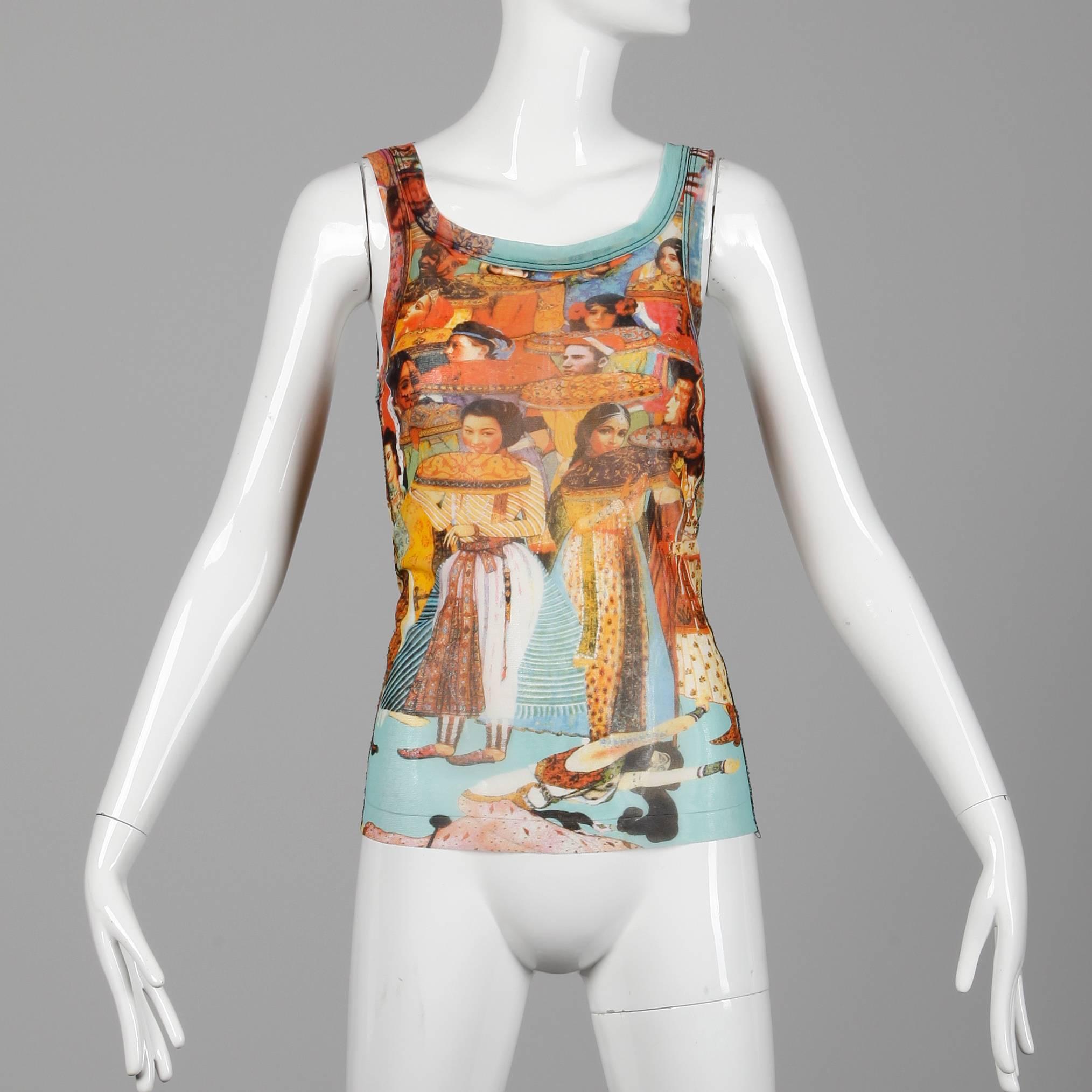 Jean Paul Gaultier mesh tank top in iconic Asian + Indian face and people print. Unlined with no closure (pulls on over the head). The marked size is medium, but this will also likely fit a small and a large as well due to the stretch of the fabric.