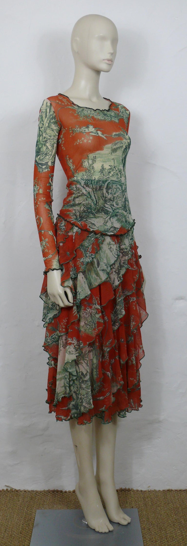 JEAN PAUL GAULTIER FUZZI mesh Toile de Jouy print ensemble including a top and a skirt.

TOP features :
- FUZZI sheer mesh with a green Toile de Jouy print on a coral color background.
- Long sleeves.
- Slips on.
- No lining.
- Size label reads :