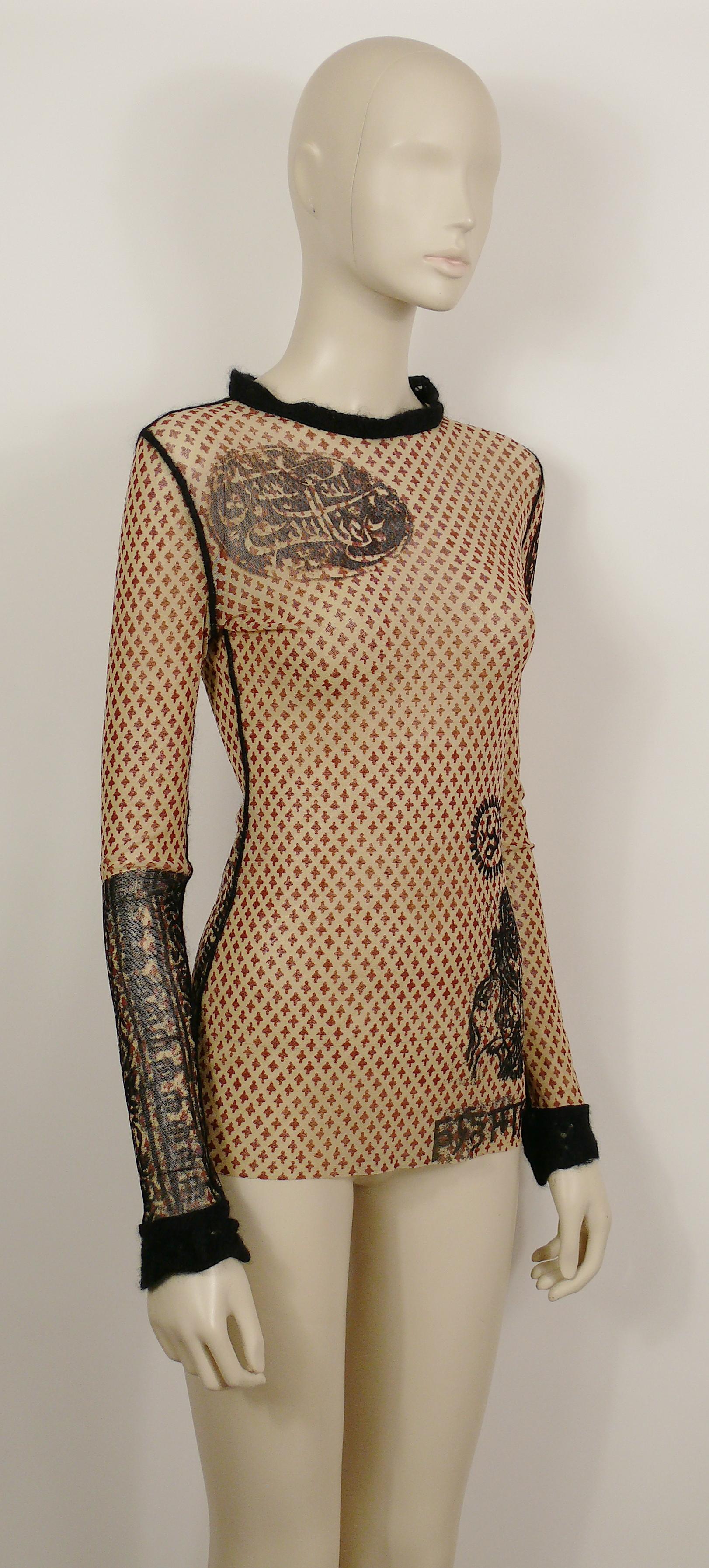 JEAN PAUL GAULTIER vintage oriental sheer mesh tattoo top featuring black angora knitted collar, cuffs and seams.

Missing brand label.
Printed JEAN PAUL GAULTIER on the mesh (see photo 4).

Missing size label.
Please refer to measurements.

Mission
