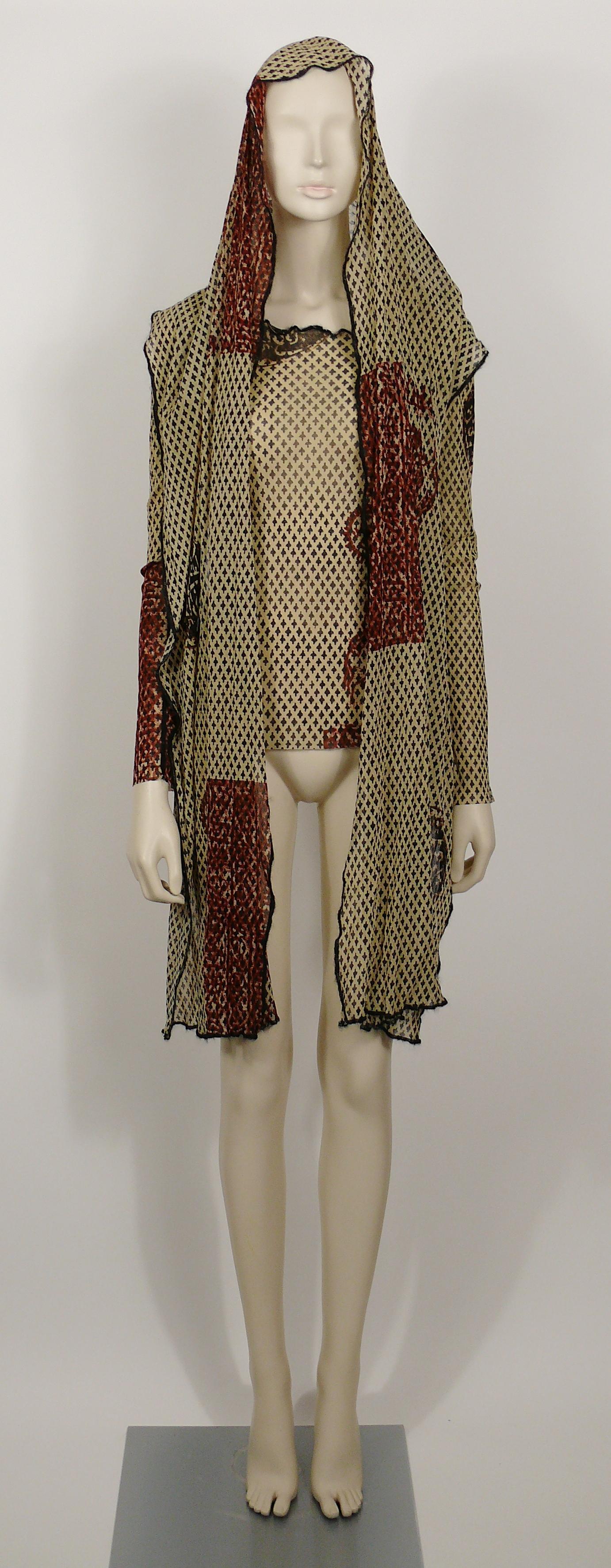 JEAN PAUL GAULTIER vintage oriental print sheer mesh tattoo top with integrated large scarf which can be used in different ways : hood, scarf, scarf collar...

Label reads JEAN PAUL GAULTIER Maille CLASSIQUE Paris.
Made in Italy.

Size label reads :
