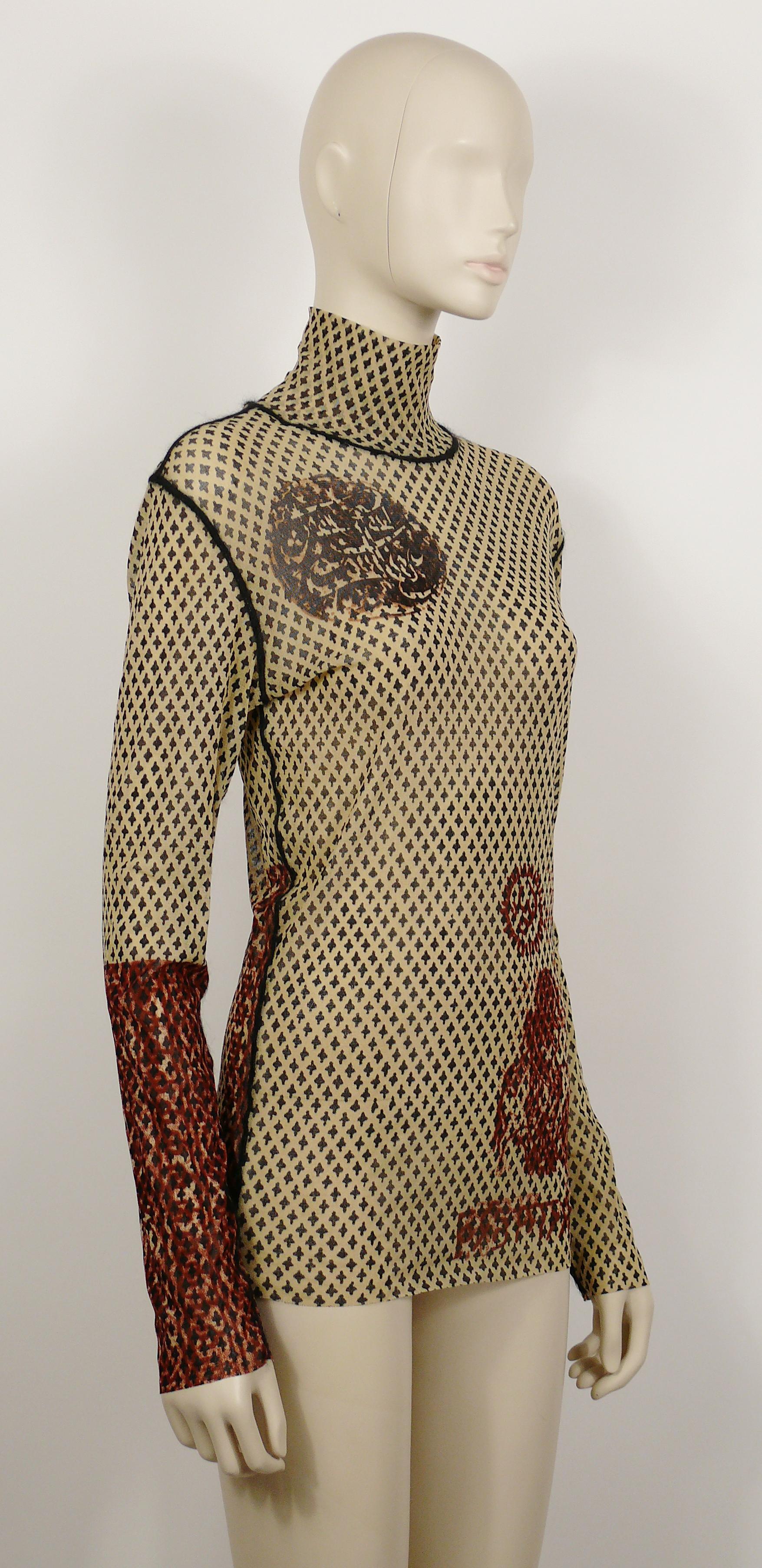 JEAN PAUL GAULTIER vintage oriental sheer mesh tattoo turtleneck top with visible black angora-like seams.

Label reads JEAN PAUL GAULTIER Maille.
Made in Italy.

Size label reads : L.
Please refer to measurements.

Mission composition