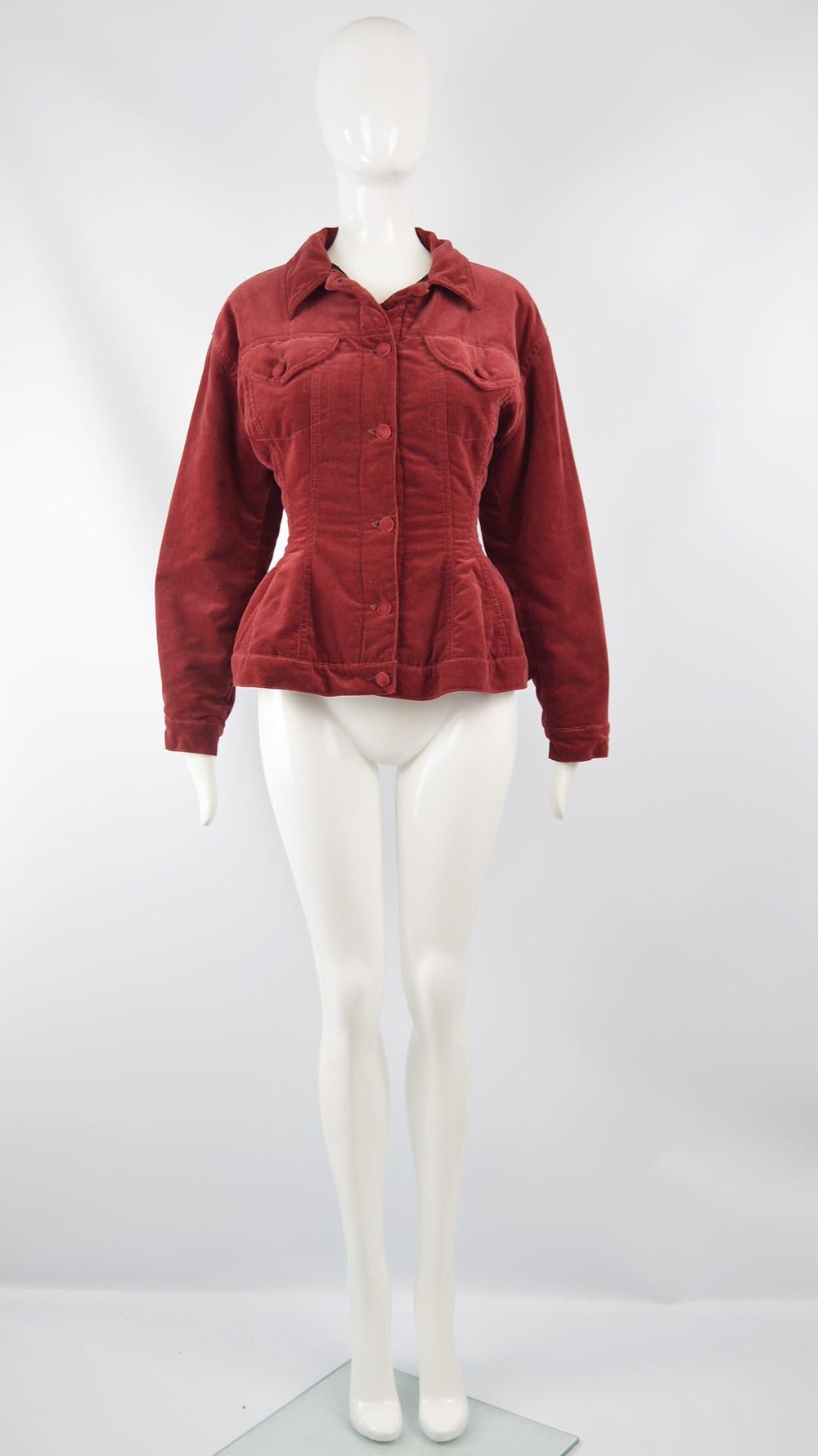 A beautiful vintage women's jacket from the 80s by iconic French fashion designer, Jean Paul Gaultier. Made in Italy, in a red velvet with covered button fastenings and a lightly quilted lining, making it perfect for spring and fall. It has