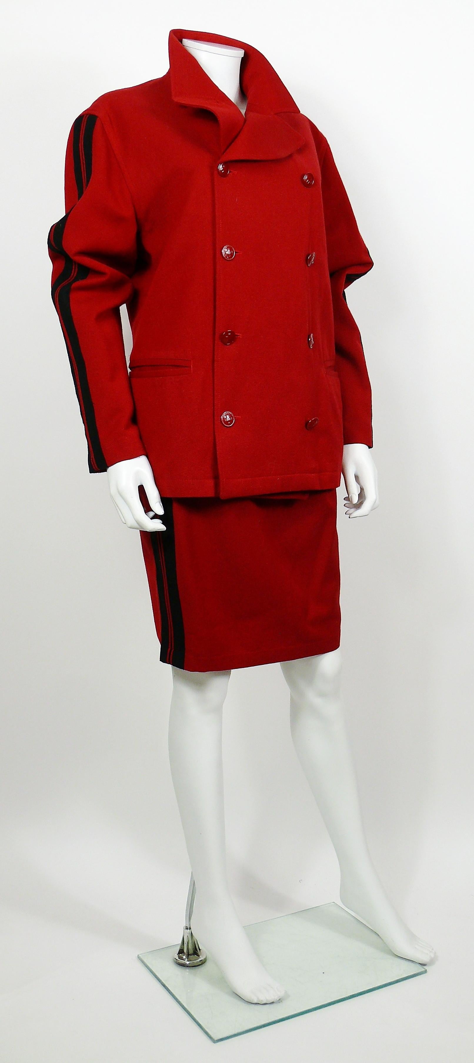 JEAN PAUL GAULTIER vintage red wool blend skirt suit.

BLAZER features :
- Red wool blend with black stripes on the sleeves.
- Double breasted.
- Lapel collar.
- Red enamel buttons.
- Two pockets.
- Fully lined.

SKIRT features :
- Red wool blend
