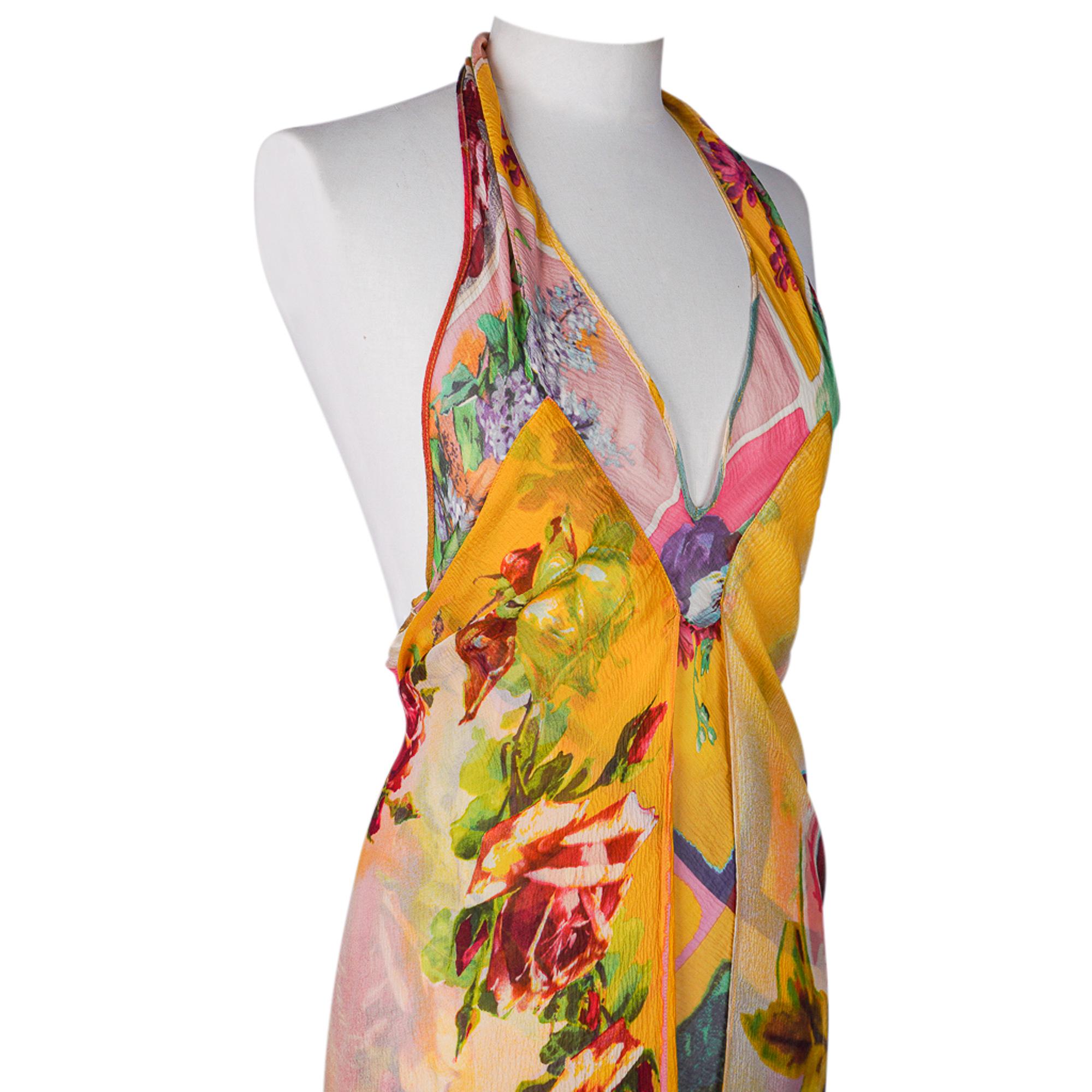 Jean Paul Gaultier 1990s vintage halter dress in lush floral print. 
Gorgeous print on feather light flowing silk chiffon. 
Plunging V neck and backless creates a feminine, sexy dress any woman will feel beautiful in.
Fabulous shades of yellows,