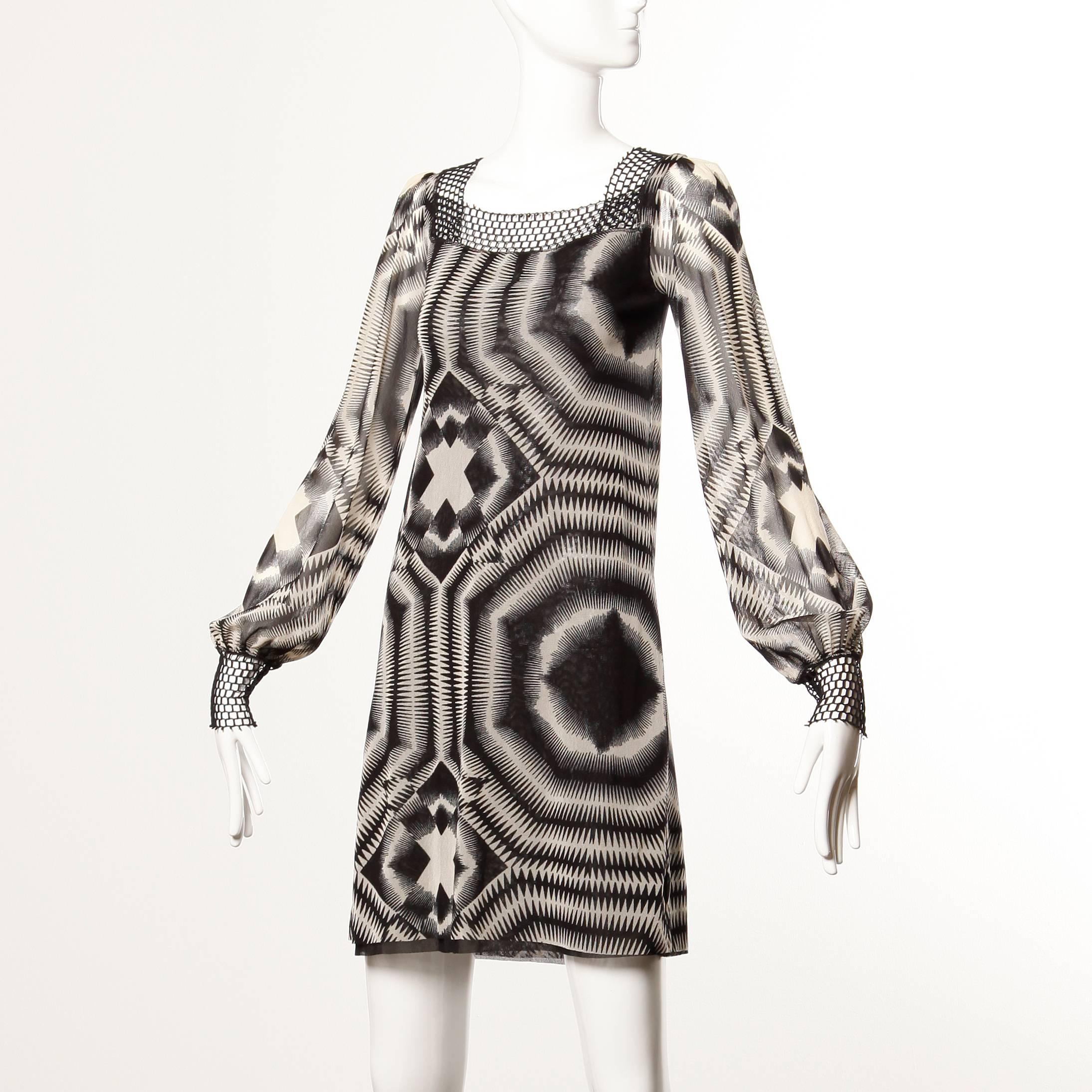 Vintage op art graphic printed mesh dress by Jean Paul Gaultier with a mod 1960s vibe. 

Details: 

Marked Size: S
Color: Black/ Off White
Fabric: 100% Nylon Mesh
Label: Jean Paul Gaultier

Measurements: 

Bust: 30