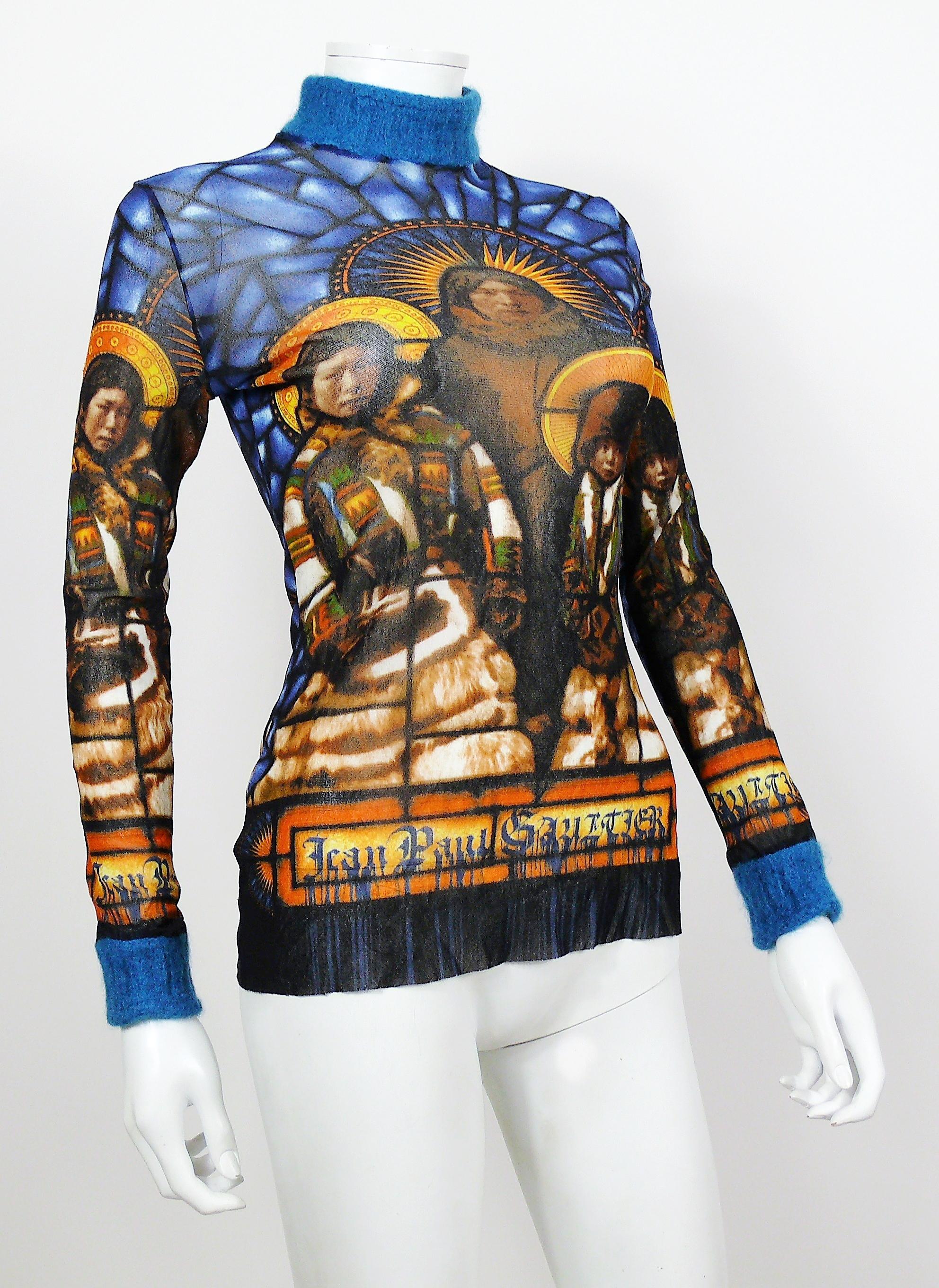 JEAN PAUL GAULTIER vintage sheer mesh top featuring a Native American Holy Family print.

Blue angora like trim on cuffs and neck.

Label reads JEAN PAUL GAULTIER MAILLE CLASSIQUE Paris.
Made in Italy.

Size label reads : L.
Please refer to