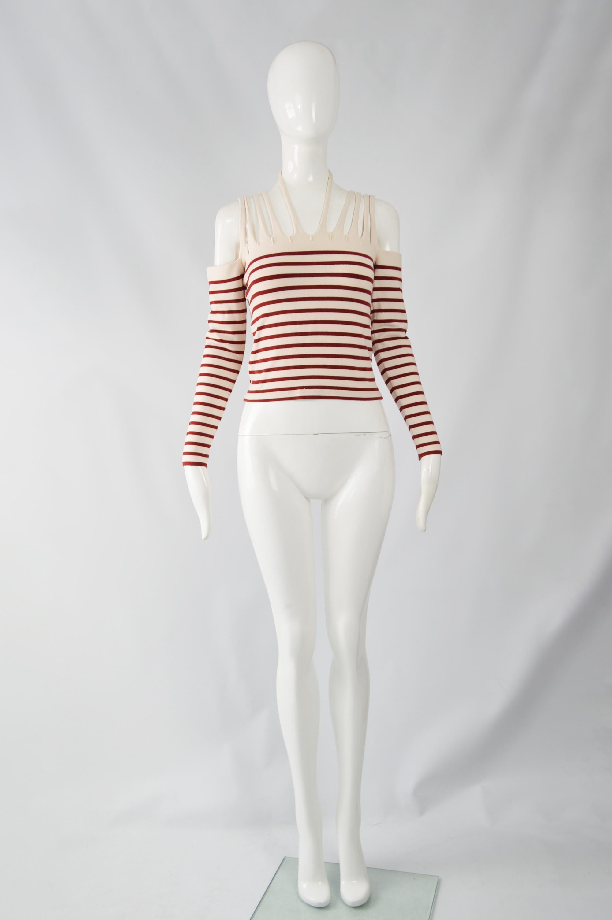 An amazing vintage Jean Paul Gaultier sweater / top from the 90s. Made in Italy, in a cotton blend knit with his iconic Breton stripe and sexy cold / off the shoulder strap details.

 Size: Marked 38 and best fits a UK 8-10/ US 4-6/ EU 36-38
Bust -