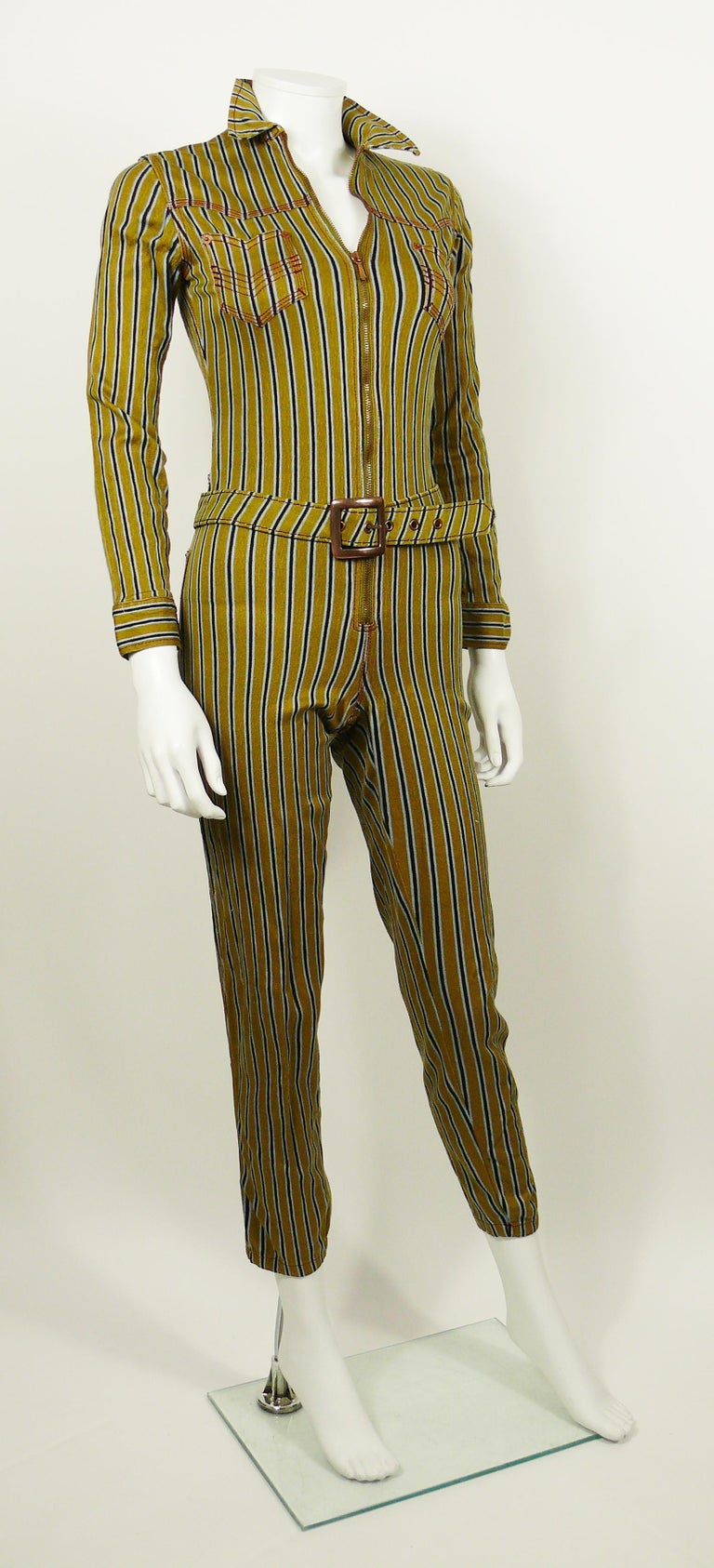 JEAN PAUL GAULTIER vintage rare striped zip-front utility jumpsuit.

This jumsuit features :
- Long sleeves with button cuffs.
- Stretchy fabric.
- Zip-front closure.
- Two breast pockets and two back pockets.
- Pointed collar.
- Contrast stitch