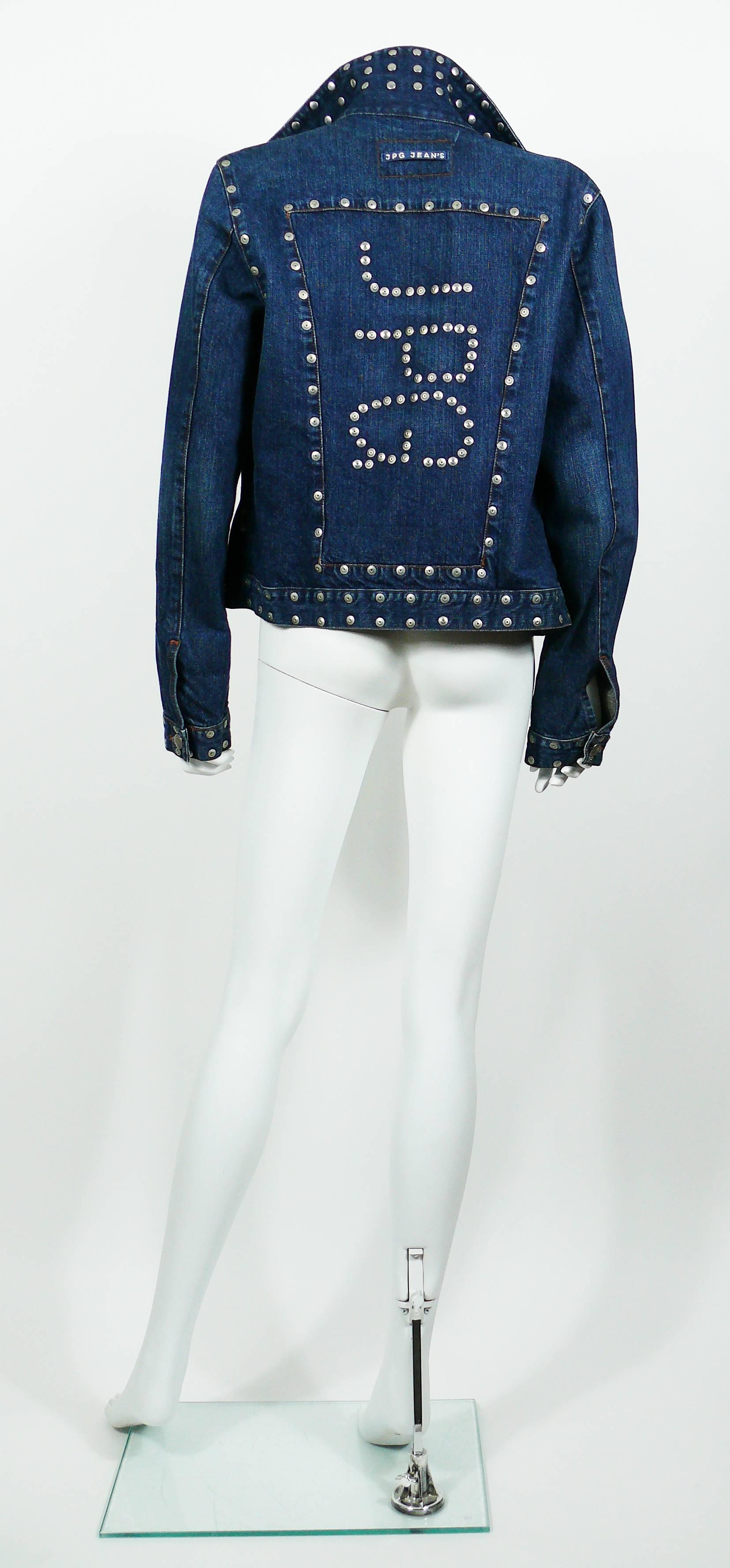 JEAN PAUL GAULTIER vintage studded denim jacket.

This jacket features :
- Silver toned studs details throughout, including JPG initials on the back.
- Classic collar.
- Two chest pockets.
- Front and cuff buttoning.
- Silver toned signature