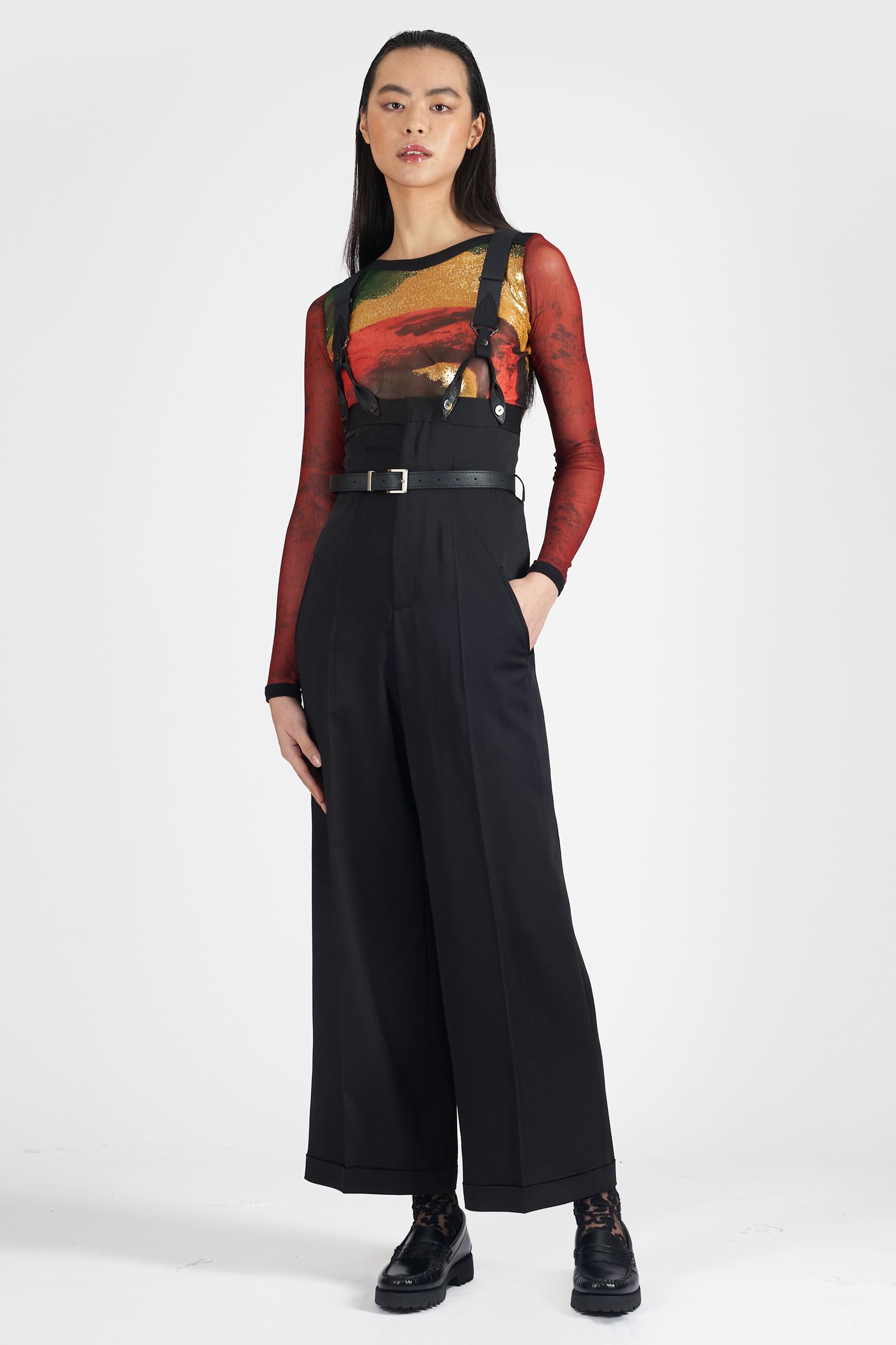 Nordic Poetry is very excited to present this Jean Paul Gaultier black high waisted suspender trouser dungarees. Features suspender top and high waist trousers with leather waist belt and straight leg fit. In excellent Vintage