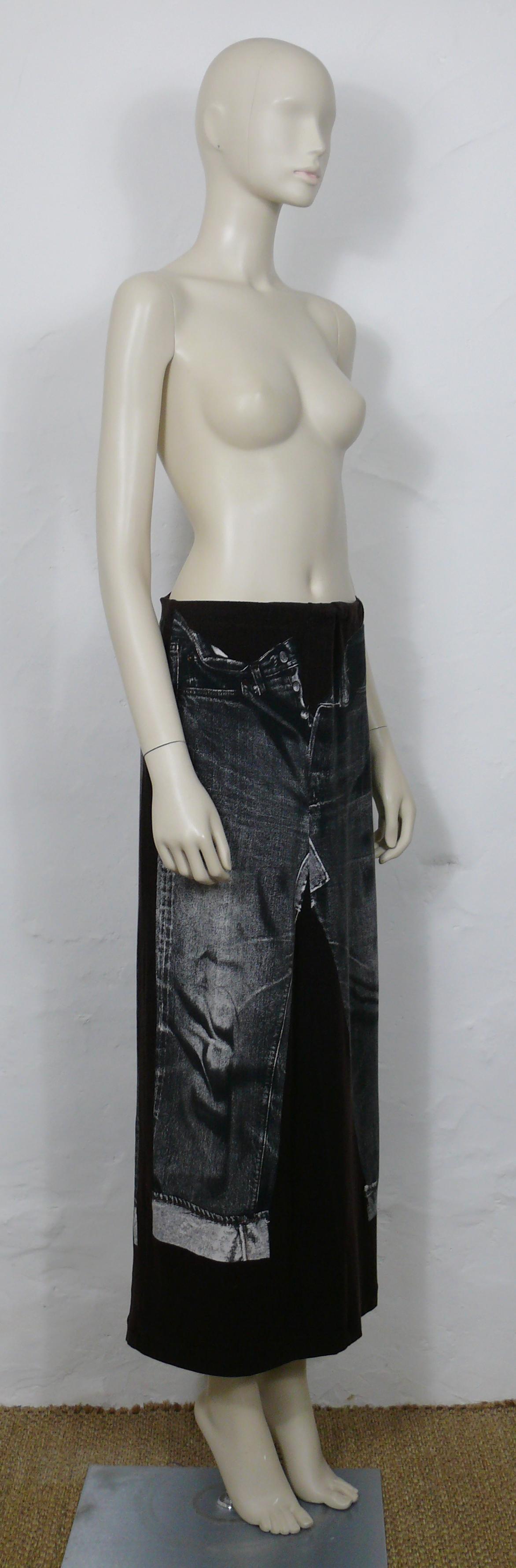 JEAN PAUL GAULTIER plum jersey skirt featuring an X-RAY screen trompe l’œil jeans on front and back.

This skirt features :
- Plum jersey background featuring distressed black/white x-ray screen trompe l’œil jeans.
- Maxi length.
- Stretchy