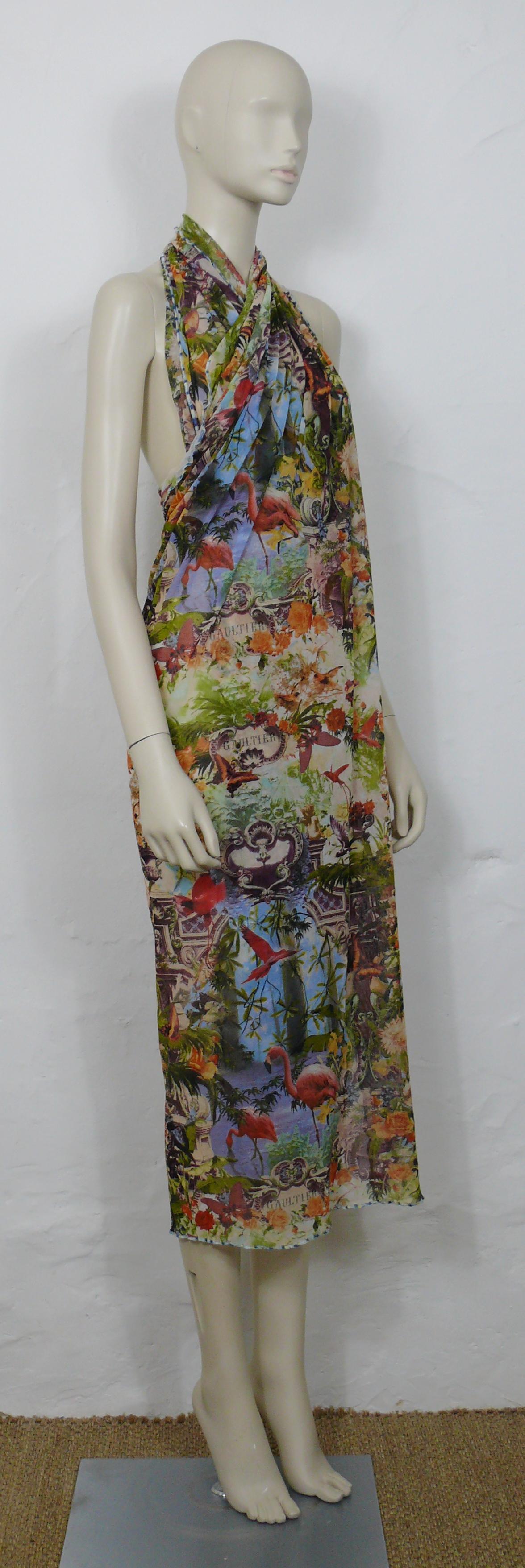 JEAN PAUL GAULTIER vintage sheer mesh pareo featuring an opulent and multicolored tropical print with flamingos, butterflies, birds, architectural elements and GAULTIER logos.

Missing brand label (see picture #7).

Missing size tag.
Please refer to