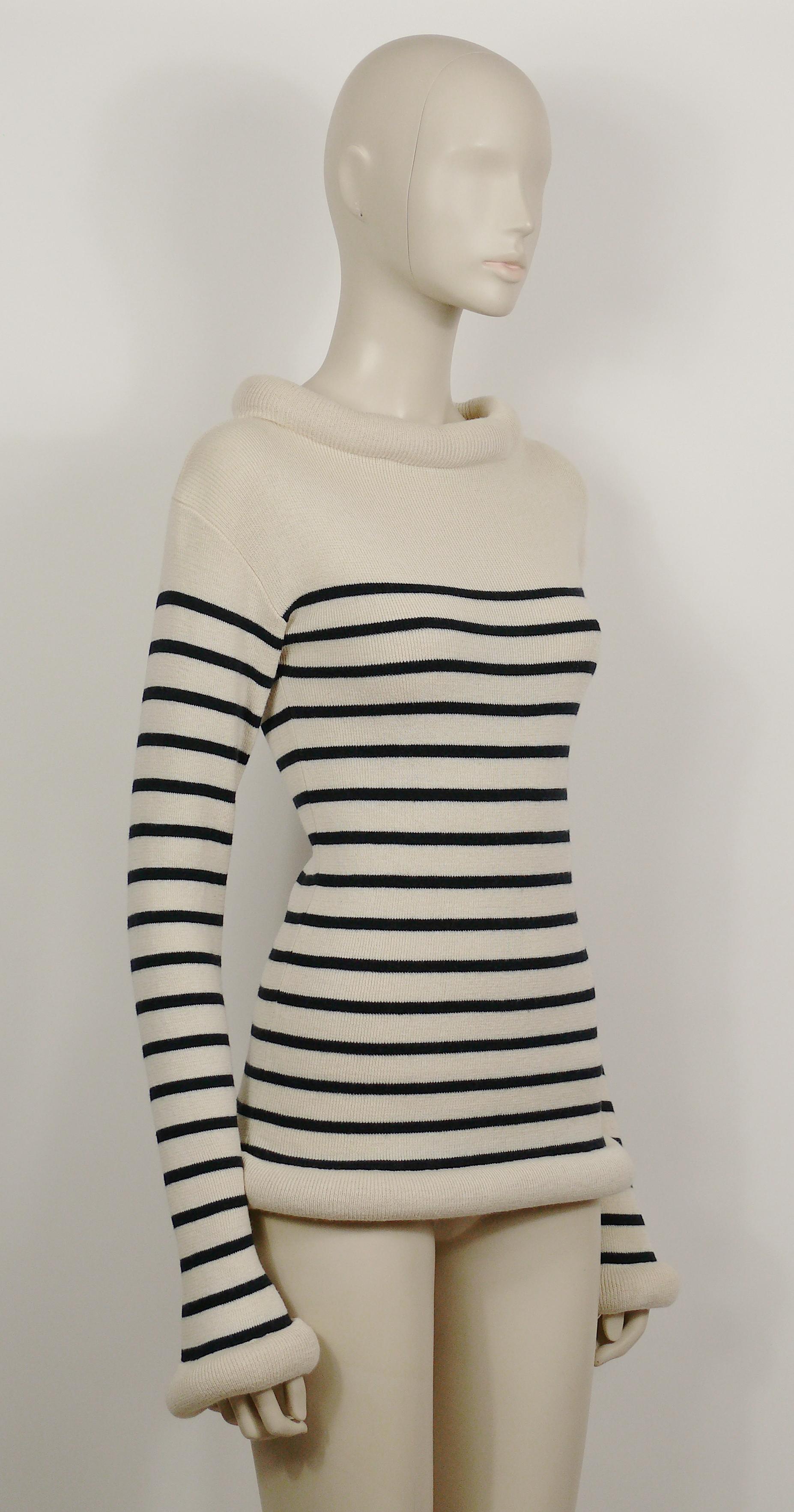 JEAN PAUL GAULTIER vintage iconic off-white/navy blue matelot sweater featuring a tube collar, cuffs and waist.

Label reads JEAN PAUL GAULTIER MAILLE Made in Italy.

Composition tag reads : 60% Virgin Wool / 40% Cotton.

Missing size tag.
Please