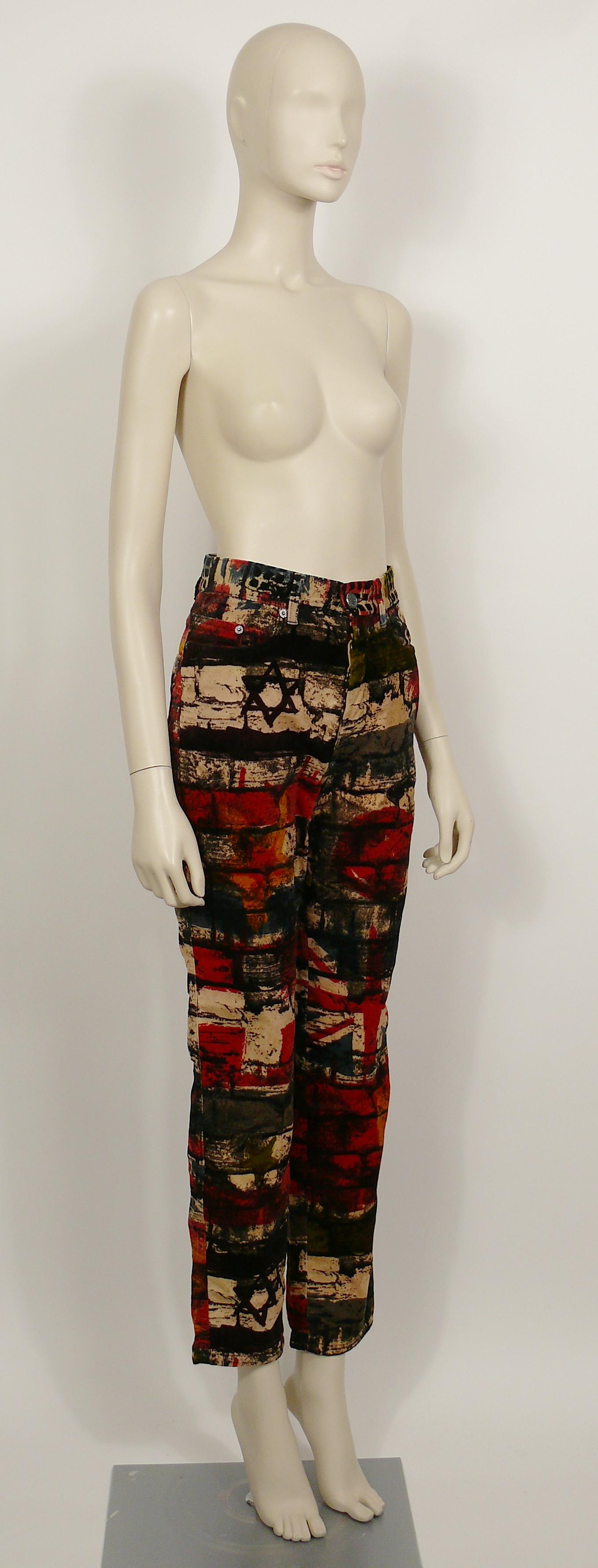 JEAN PAUL GAULTIER vintage pants trousers featuring a multi colored wall and flags print.

These trousers feature :
- Velvety touch material.
- Front buttoning.
- Front and back pockets.
- Belt loops and signature brand loop at the back.

Label