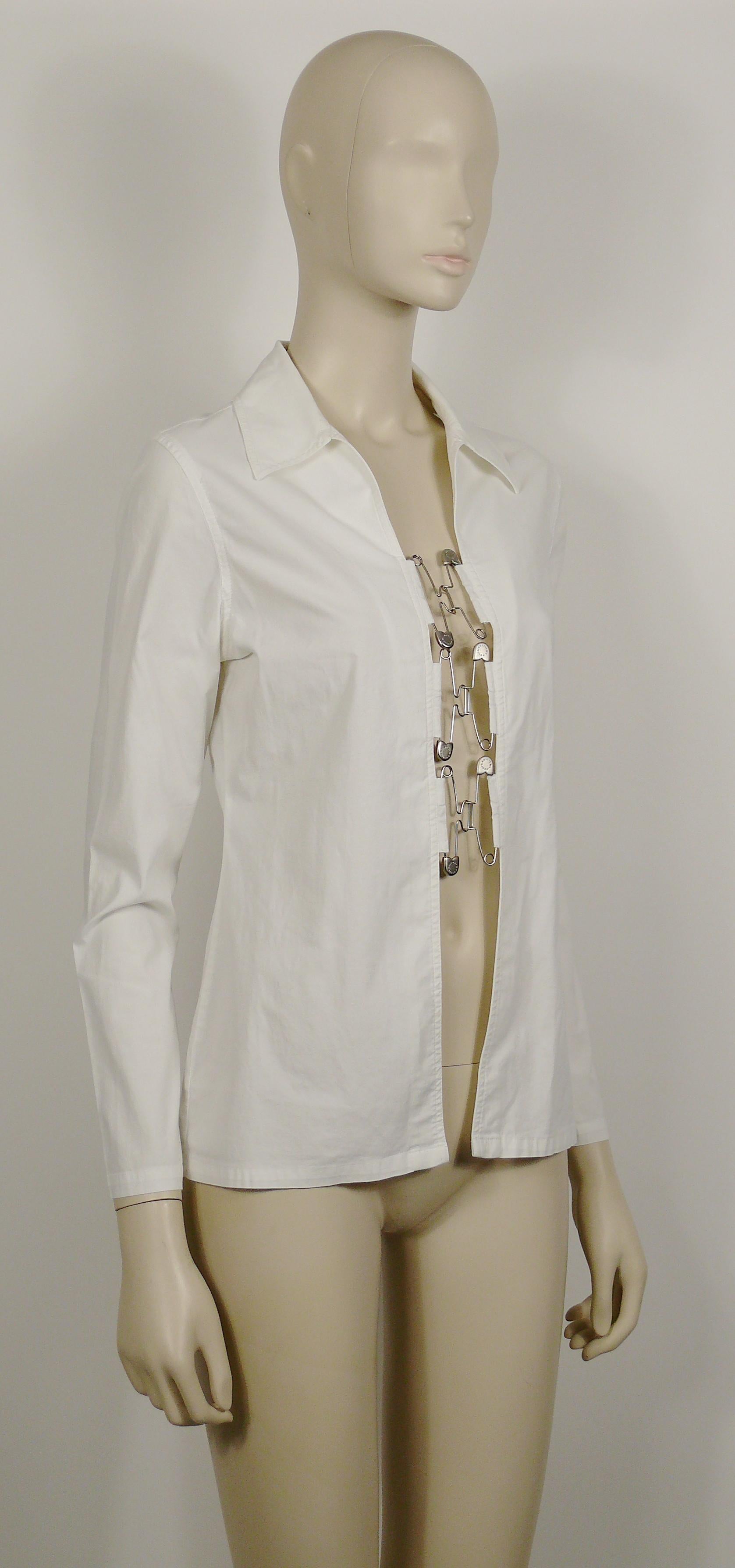 JEAN PAUL GAULTIER vintage white shirt featuring safety pin hook closures at the front.

Missing brand label (cut out).
Back bolduc ribbon GAULTIER JEAN'S.

Missing size tag.
Please check the measurements.

Missing composition tag (probably cotton