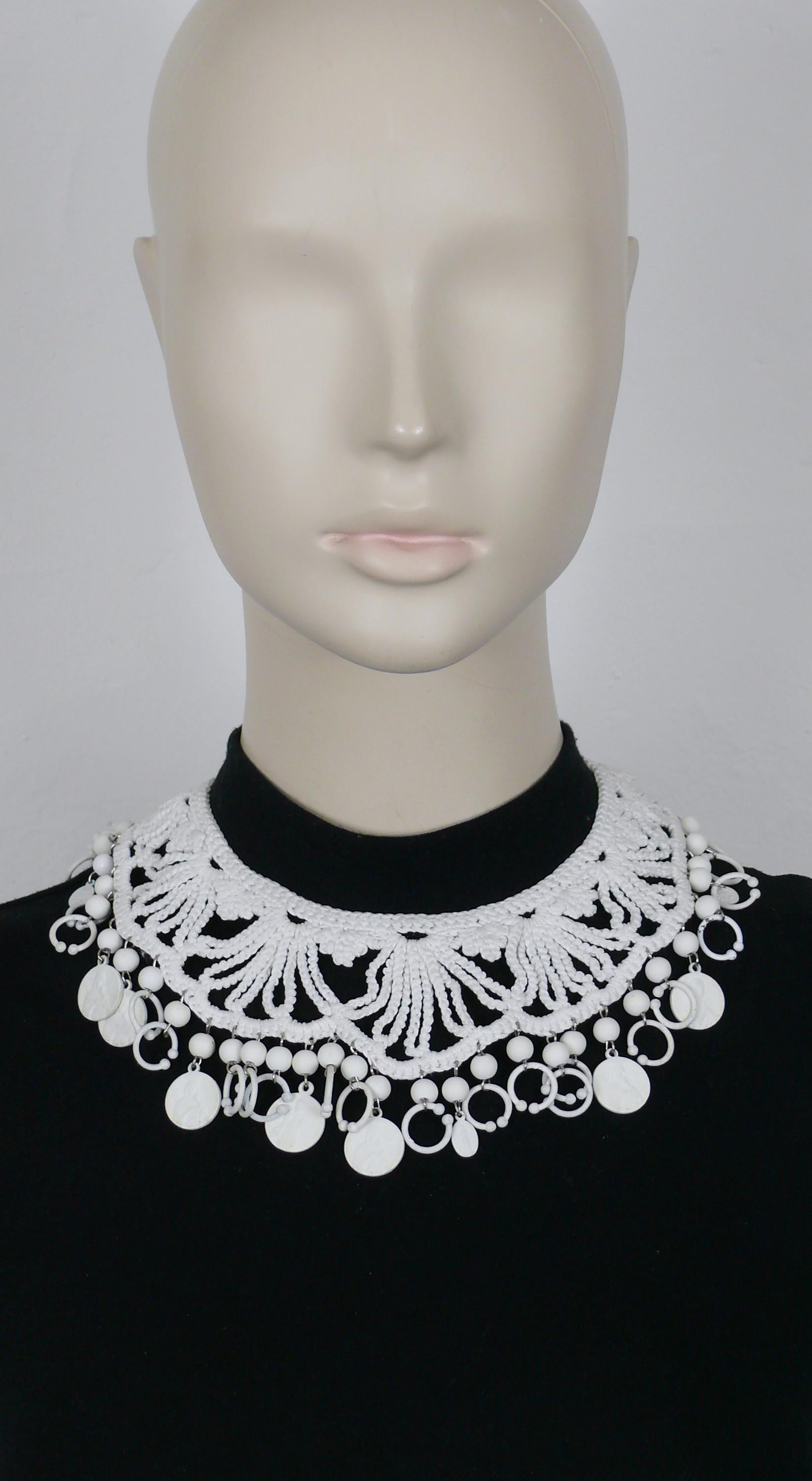 JEAN PAUL GAULTIER  white crochet collar necklace embellished with off white beads, rings and religious medals.

Double-prong fastener

Marked JEAN PAUL GAULTIER.

Indicative measurements : inner circumference approx. 36.13 cm (14.22 inches).

Comes