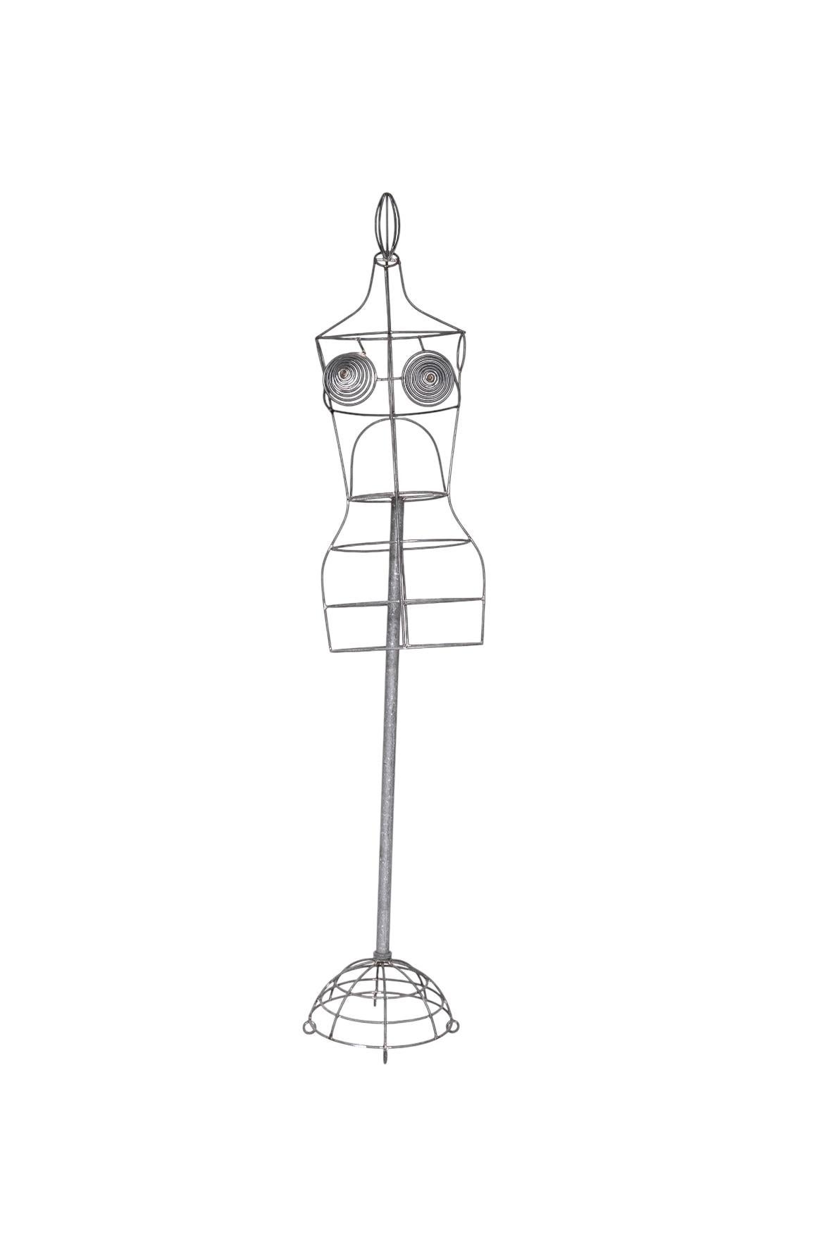 Un icónico y coleccionable maniquí con forma de vestido de alambre del legendario diseñador francés Jean Paul Gaultier, creado en la década de 1990. Esta pieza escultural ejemplifica la estética atrevida y vanguardista de Gaultier y es una