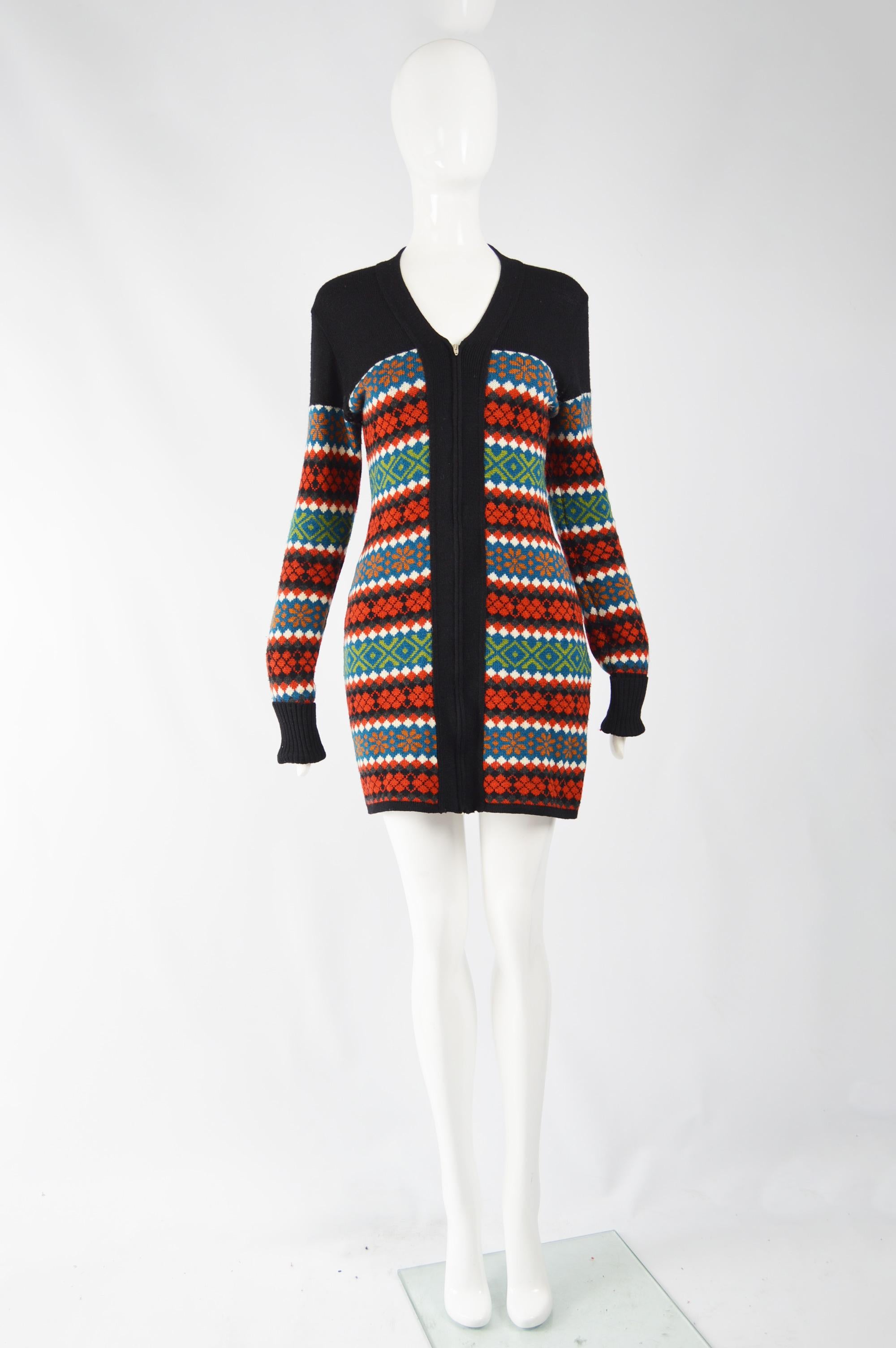 An incredible and rare vintage womens mini sweater dress from the 80s by Jean Paul Gaultier. In a red, and black wool knit with a fairisle pattern throughout, extra long sleeves and zip front.

Size: Marked IT42 which equated to a UK 10/ US 6/ EU