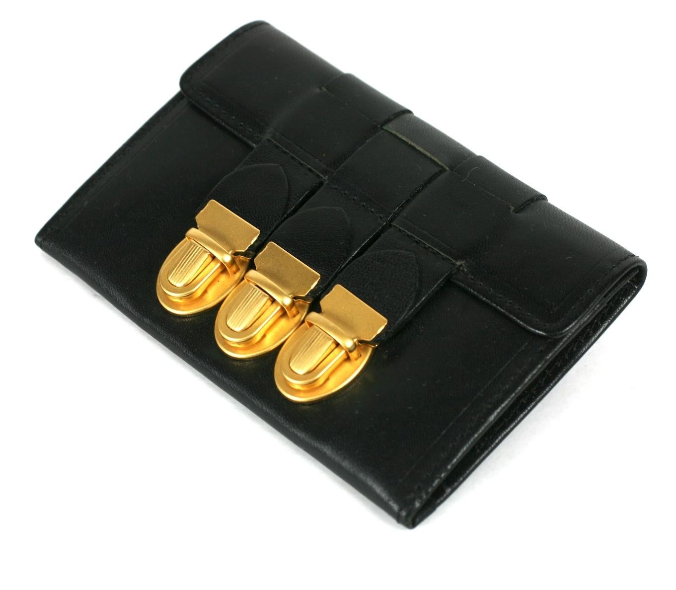 Jean Paul Gaultier Woven Wallet Card Holder in sturdy black leather with triple matte gold locks from the 1980's. Includes original box and pouch.  1980's France. 
4.5