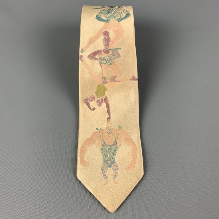 JEAN PAUL GAULTIER necktie comes in a yellow & blue silk with a all over abstract figure print. Made in Italy.

Very Good Pre-Owned Condition.

Measurements:

Width: 2.75 in.
Length: 59 in. 