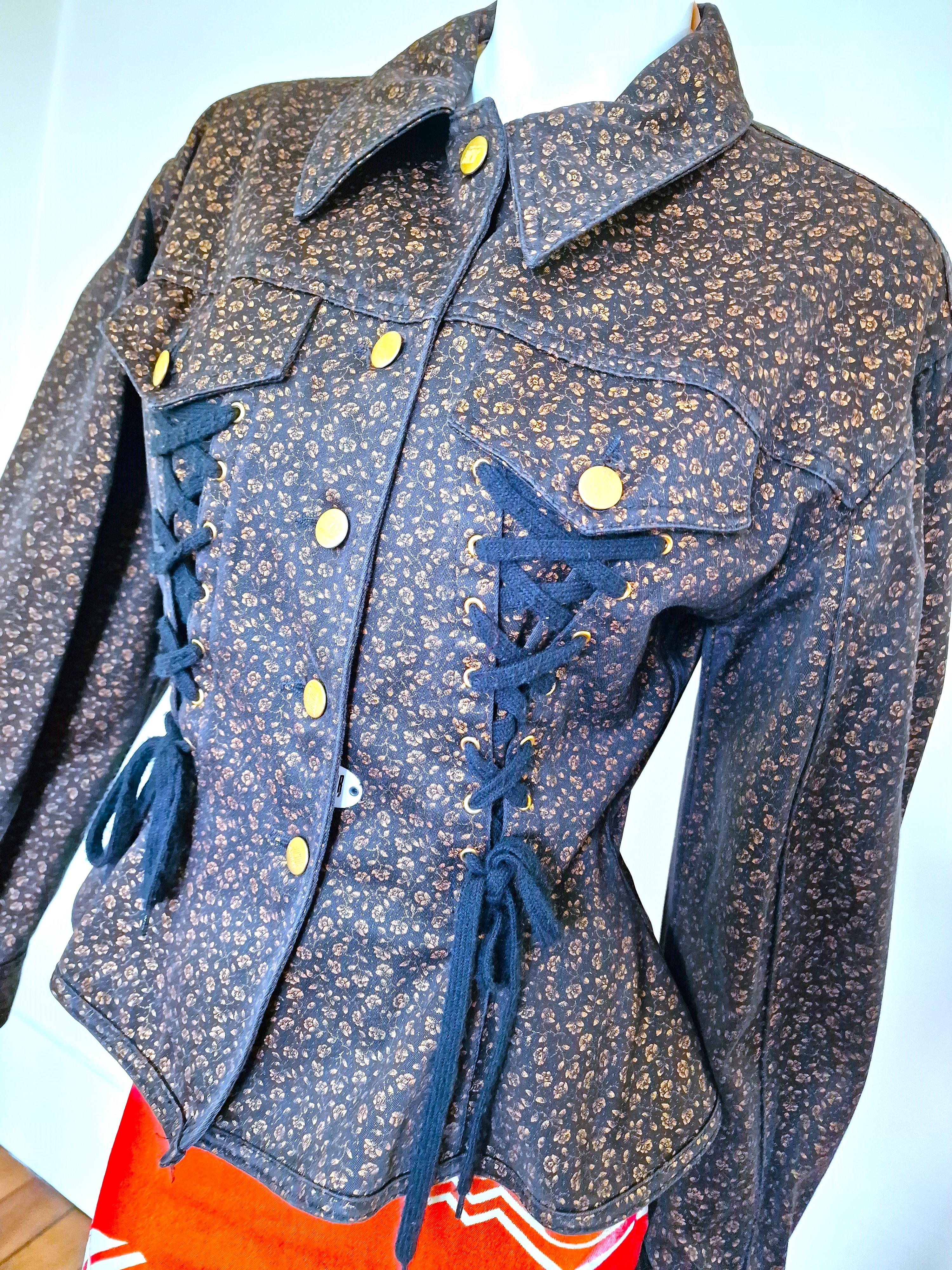 One of the most iconic Junior Gaultier pieces in the most adorable dark denim with golden flower pattern will snatch your waist! 
With oversized shoulders and corseted elements, although it pokes out at the 80s, it’s is still brilliantly 

EXCELLENT