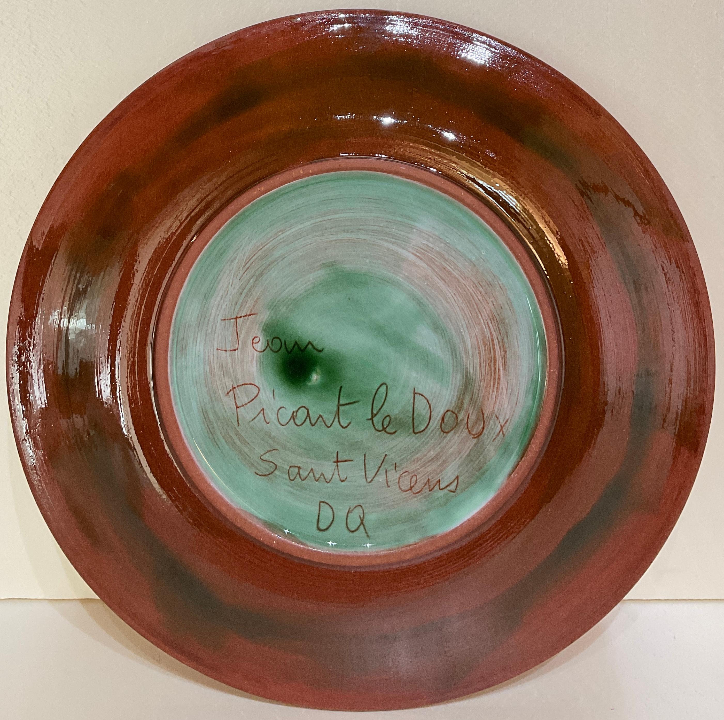 French mid-century ceramic bowl by Jean Picart Le Doux, France, 1950s. 
Glazed.

Very colorful and pleasing to the eye. This beautiful handcrafted, hand painted bowl or dish will enhance any wall, table, shelf or countertop.

Measures: diameter 9