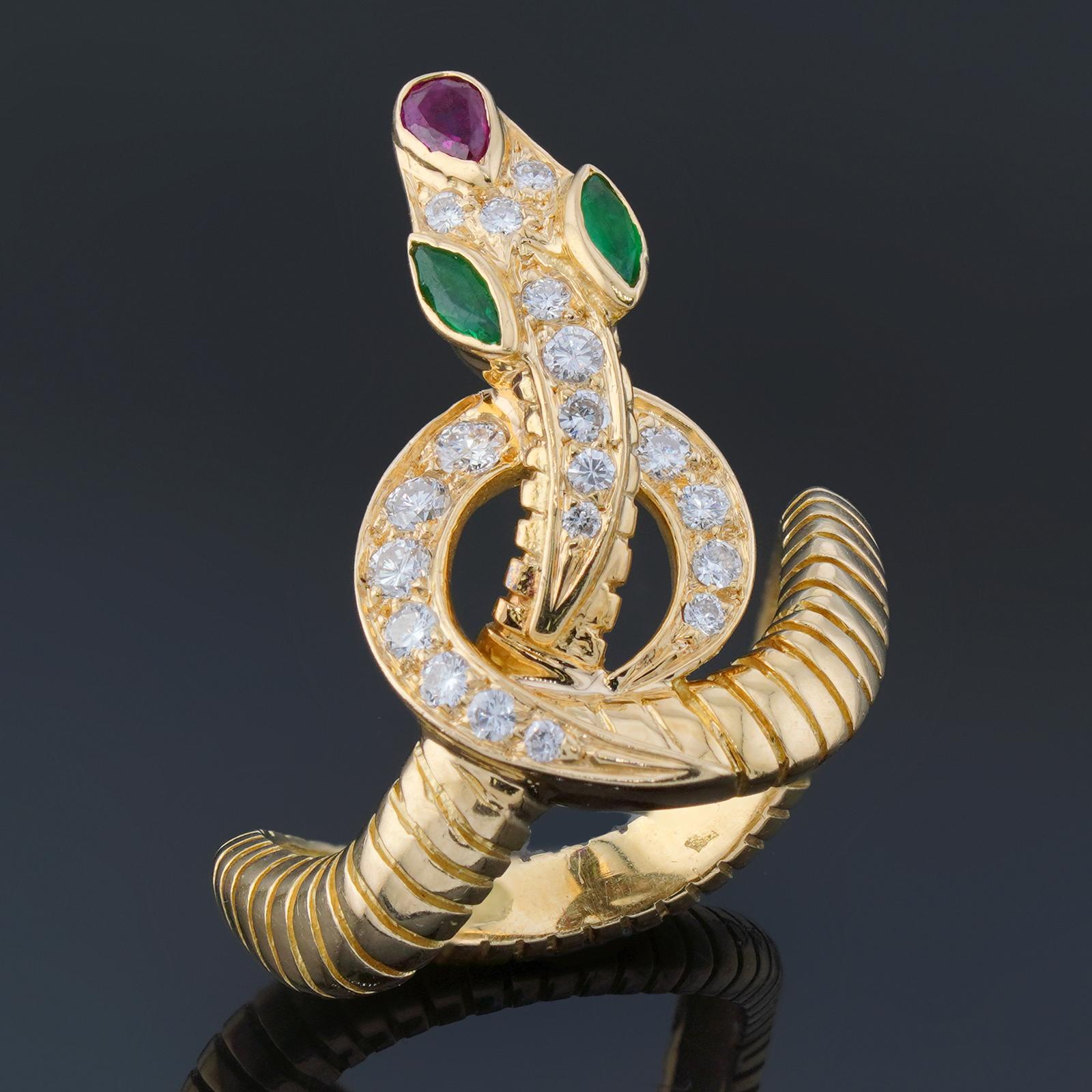 This gorgeous vintage Jean-Pierre Belin Serpenti ring features a snake design crafted in 18k yellow gold and set with emerald eyes, ruby nose, and diamond scales. Made in France circa 1970s. Measurements: 0.47