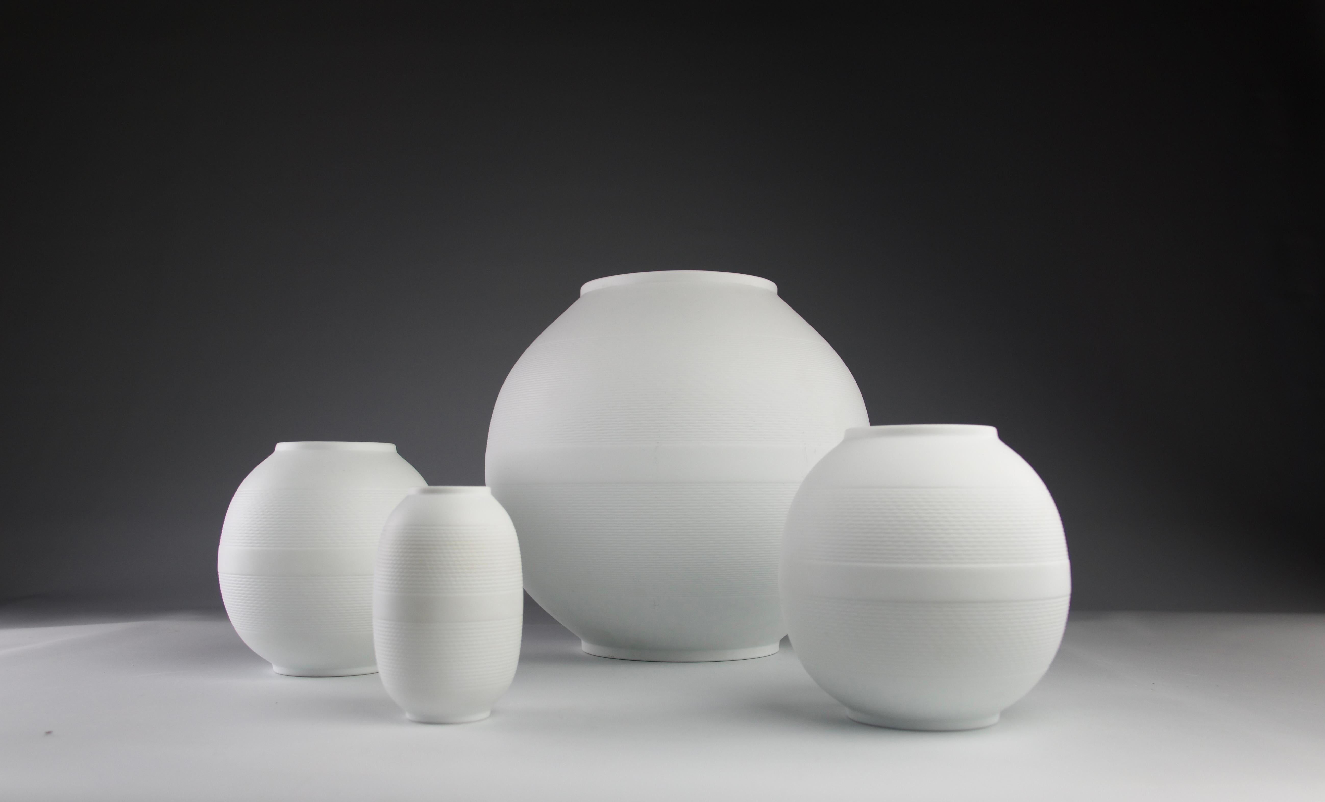 Superb set of four beautiful Néreides collection vases by the Bernardaud Maison. Manufactured in 1988 for two vases and reedition for two. Signed Bernardaud and with the name of the collection for two vases.

Dimensions in cm (H x D) :

Large Ball :