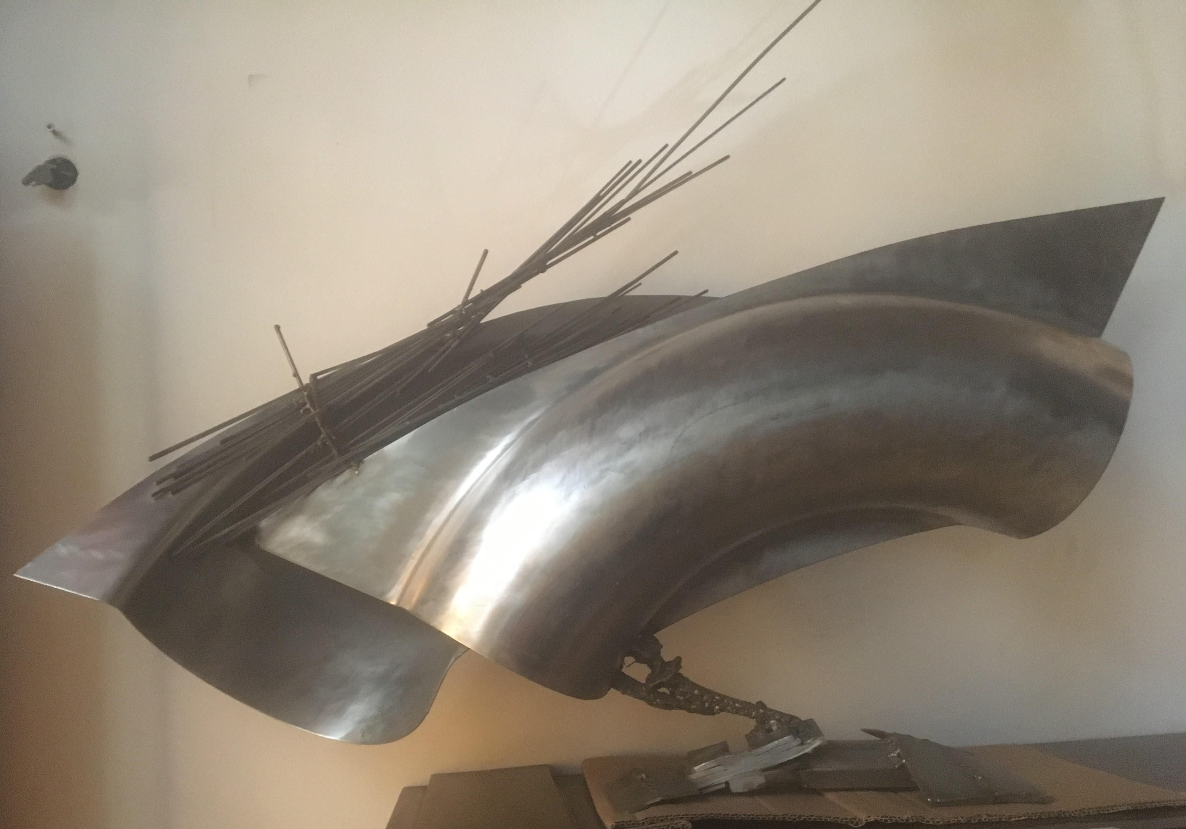 An abstract metal sculpture made by Jean Pierre Rives in France, circa 1990s.
A large model for an unusual interior decoration.
Unique creation, signed on the base

Jean Pierre Rives (1952) is a French sculptor.
A former rugby champion, since