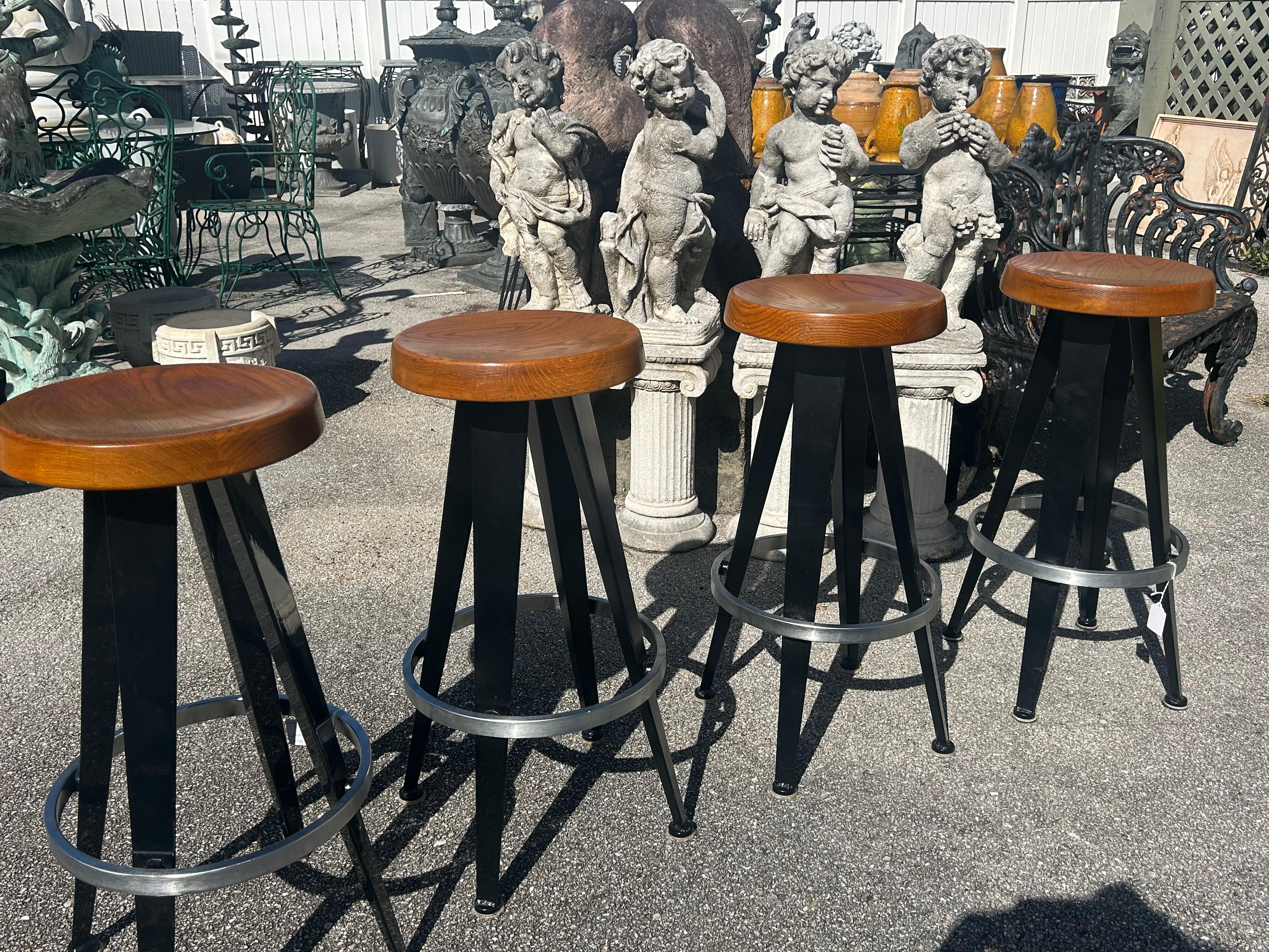 Late 20th Century Jean Prouve after. Four modernist barstools.
