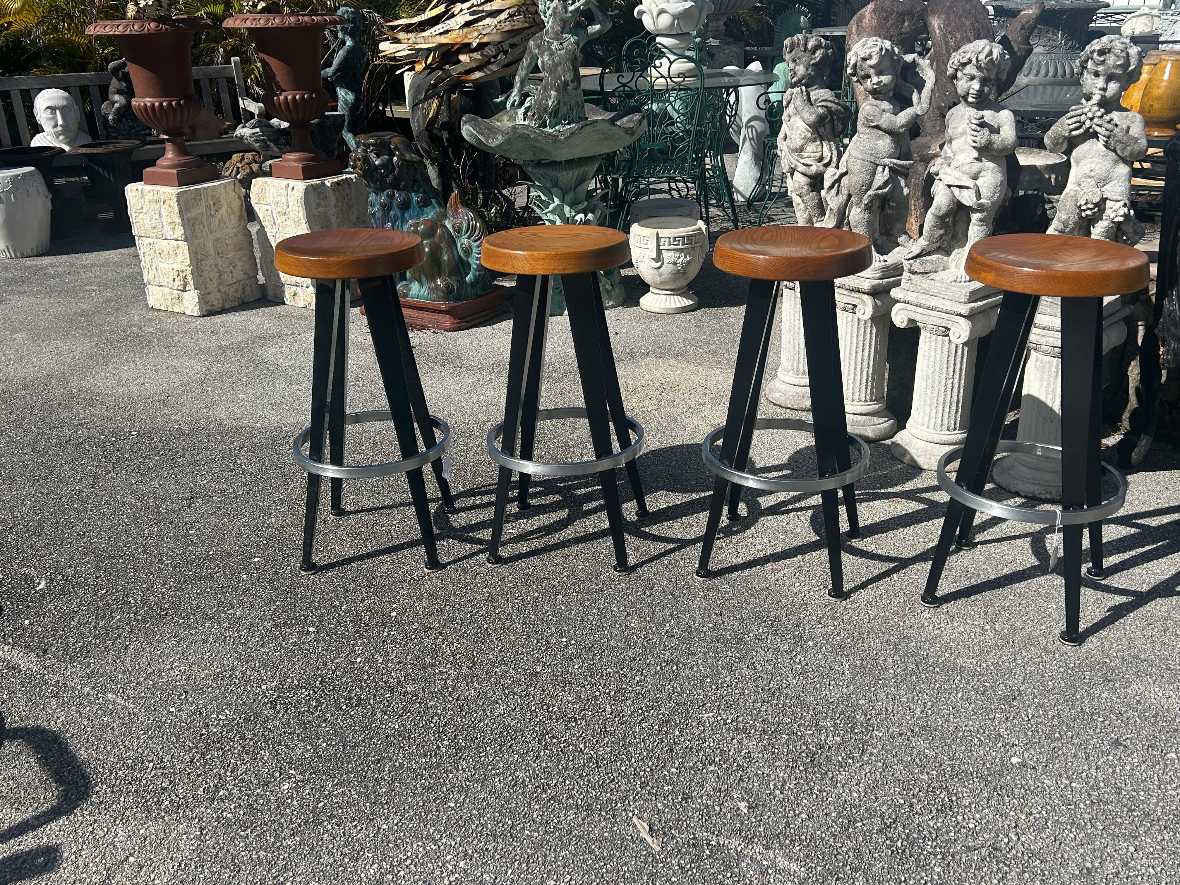 Steel Jean Prouve after. Four modernist barstools.