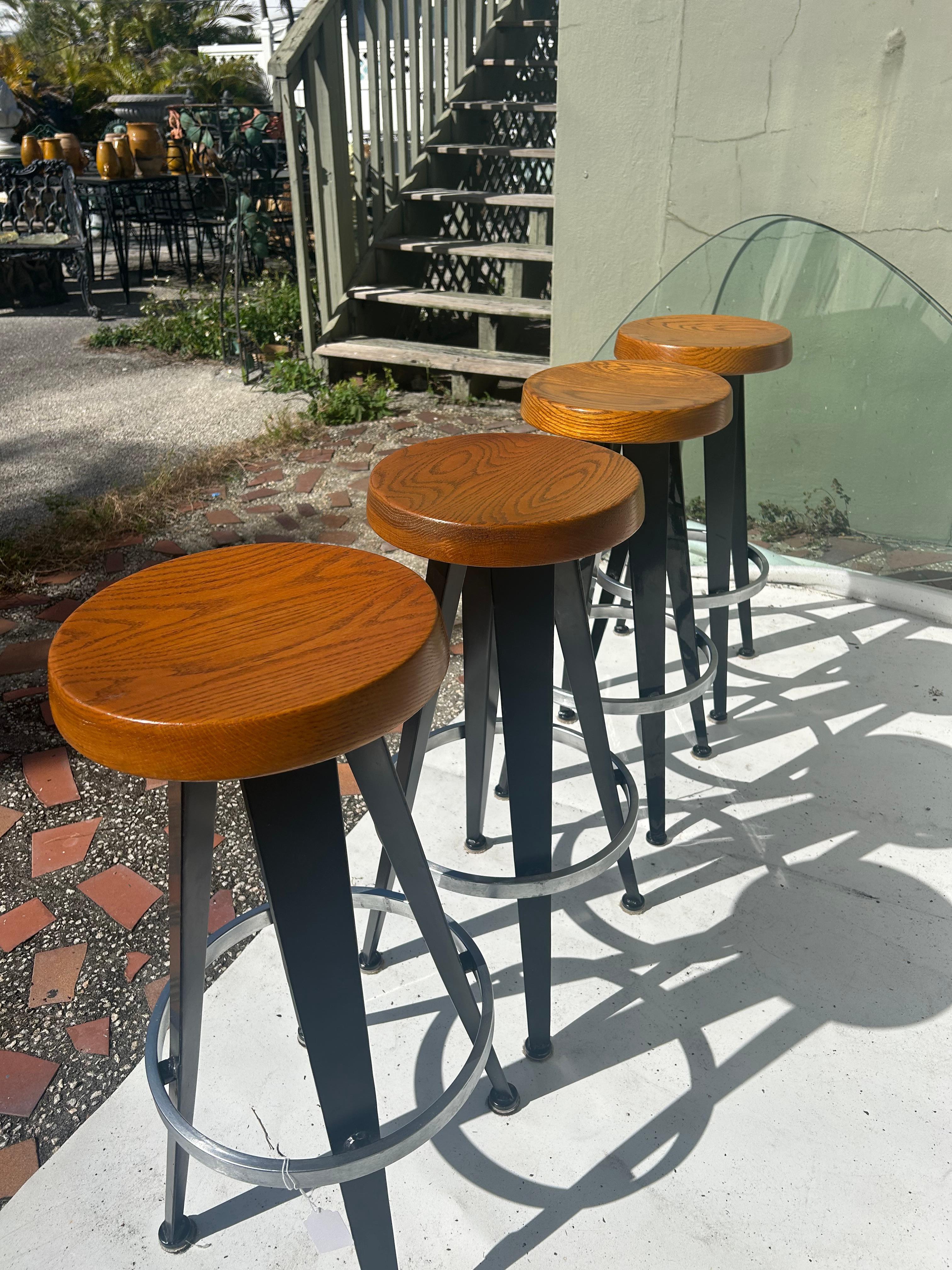 Jean Prouve after. Four modernist barstools. 2